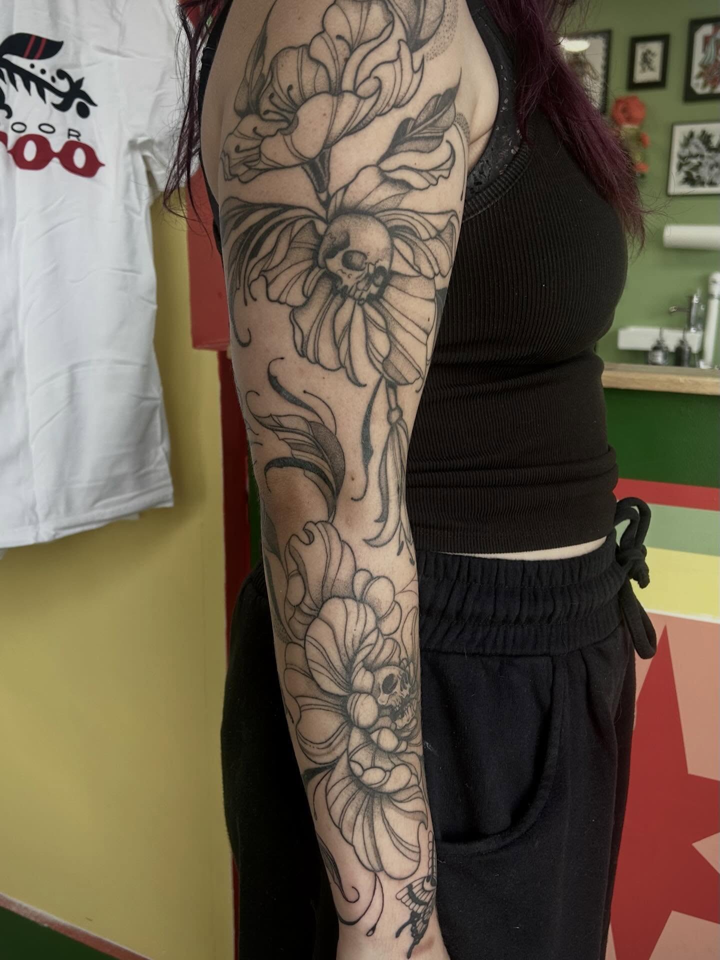Floral skull black and grey tattoo on the forearm by Bria🩸