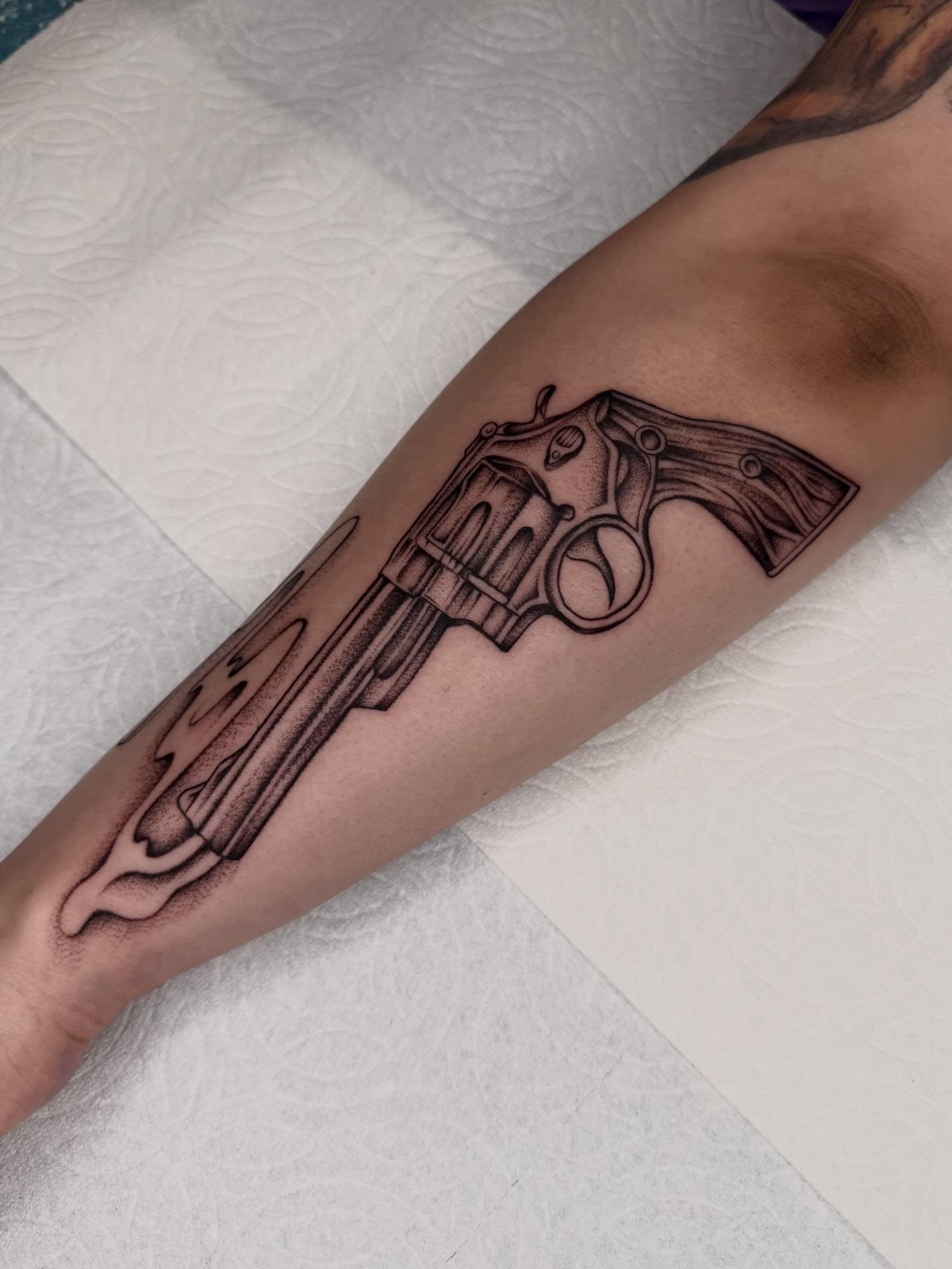 Revolver black and grey tattoo on the forearm by Nadia ★