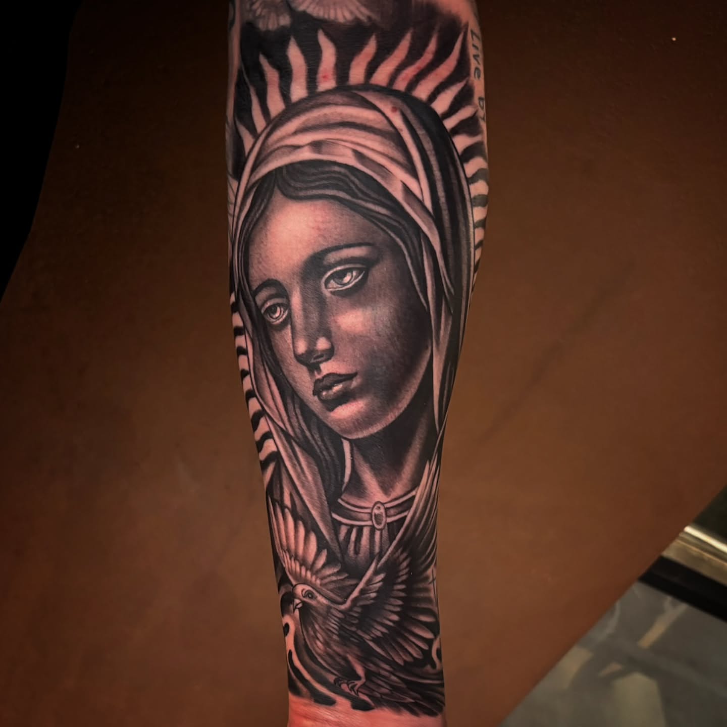 Woman's face realism tattoo on the forearm by Jack Jr Mora