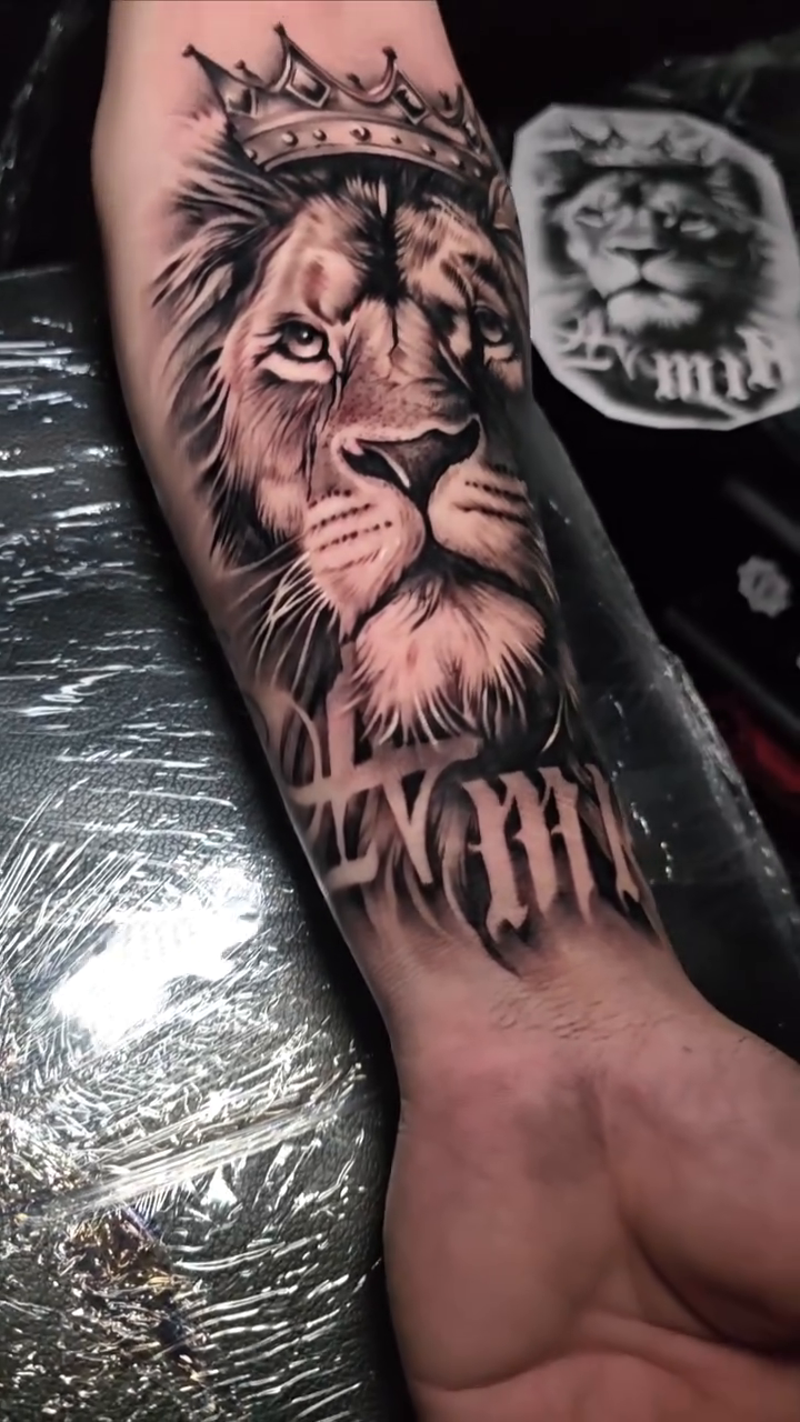 Lion with crown and Roman numerals realism tattoo by Nathan Mathers Tattooist