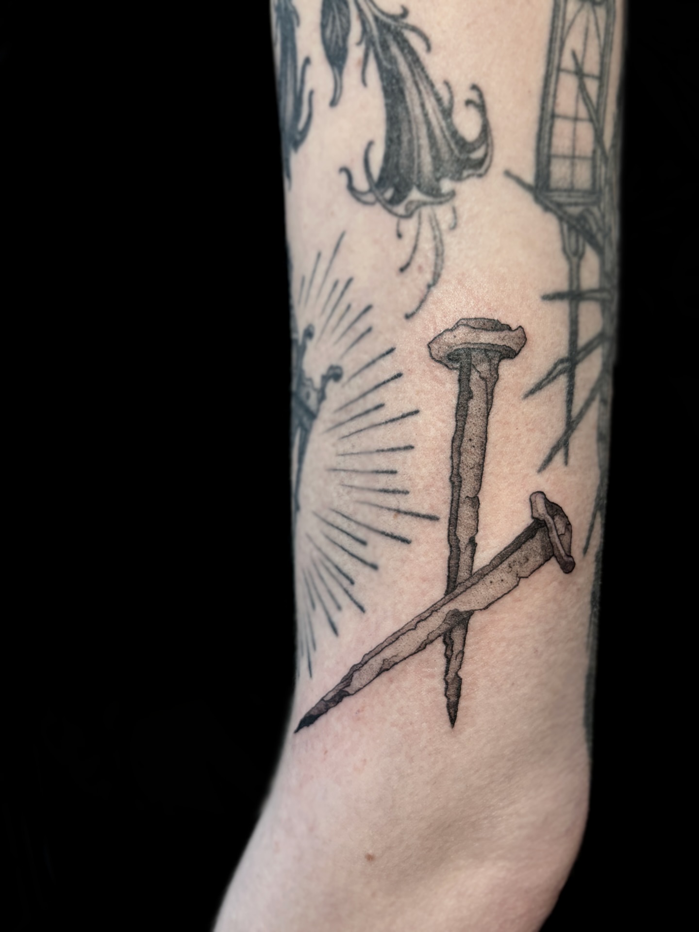 Nail and sunburst black and grey tattoo on the forearm by ๐ฎ๐๐๐๐๐๐๐๐๐๐๐ โฑ ๐พ๐๐๐๐ ๐ฟ๐๐๐๐๐