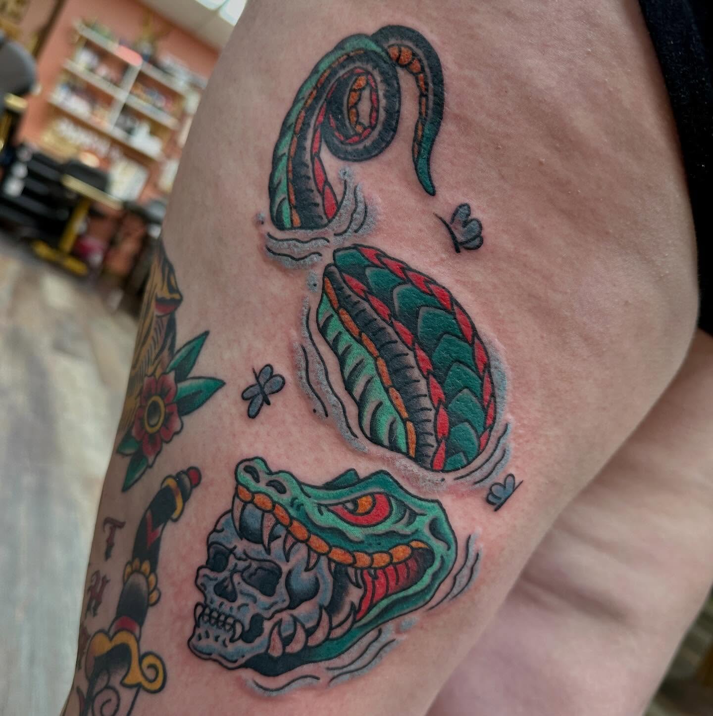 Snake and skull American traditional tattoo on the forearm by Shaila Roach Decorative & Cosmetic Tattooer