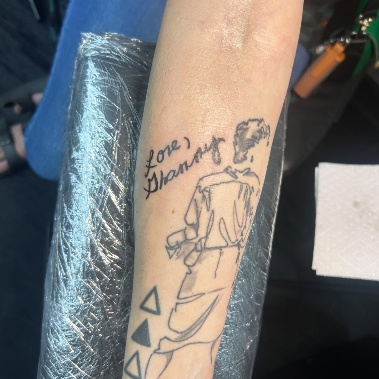 Man with signature black and grey tattoo on the forearm by Lilith Honeycutt 🪐