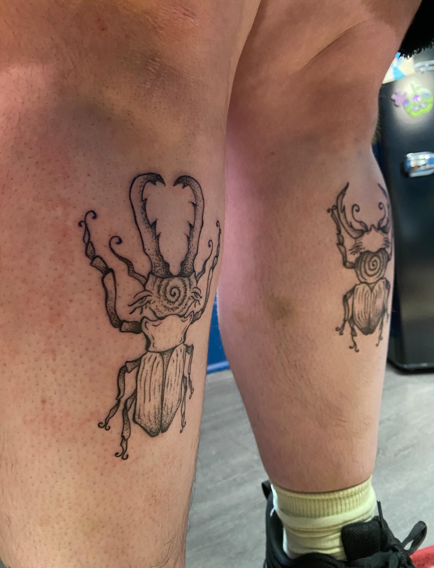 Scarab beetle black and grey tattoo on the thigh by Jesikah Rapp