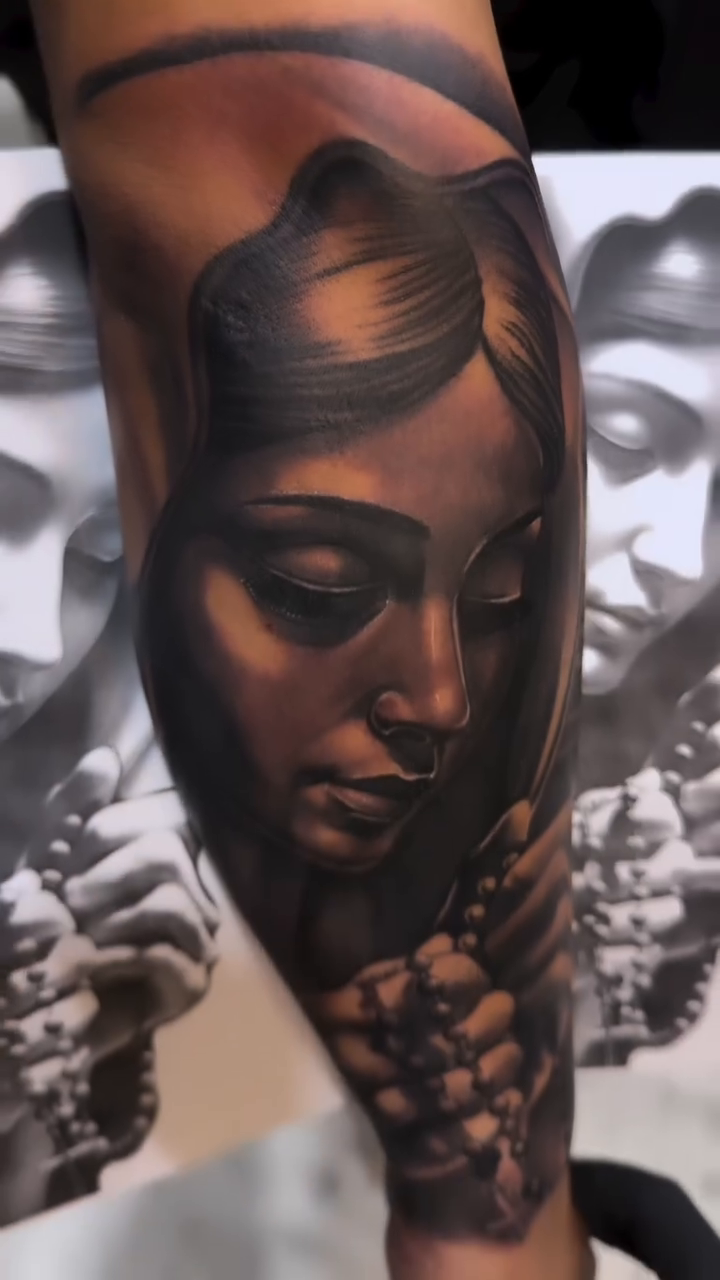 Virgin Mary with rosary realism tattoo by Tattoo