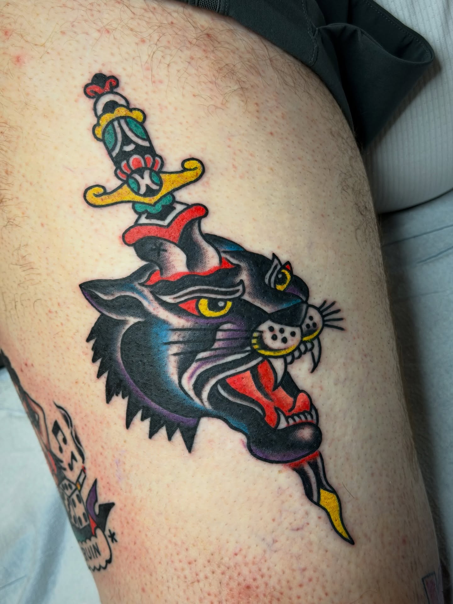 Panther with sword American traditional tattoo on the thigh by 🌈KNOXVILLE’S FAVORITE TATTOO ARTIST 👽 마법 버섯