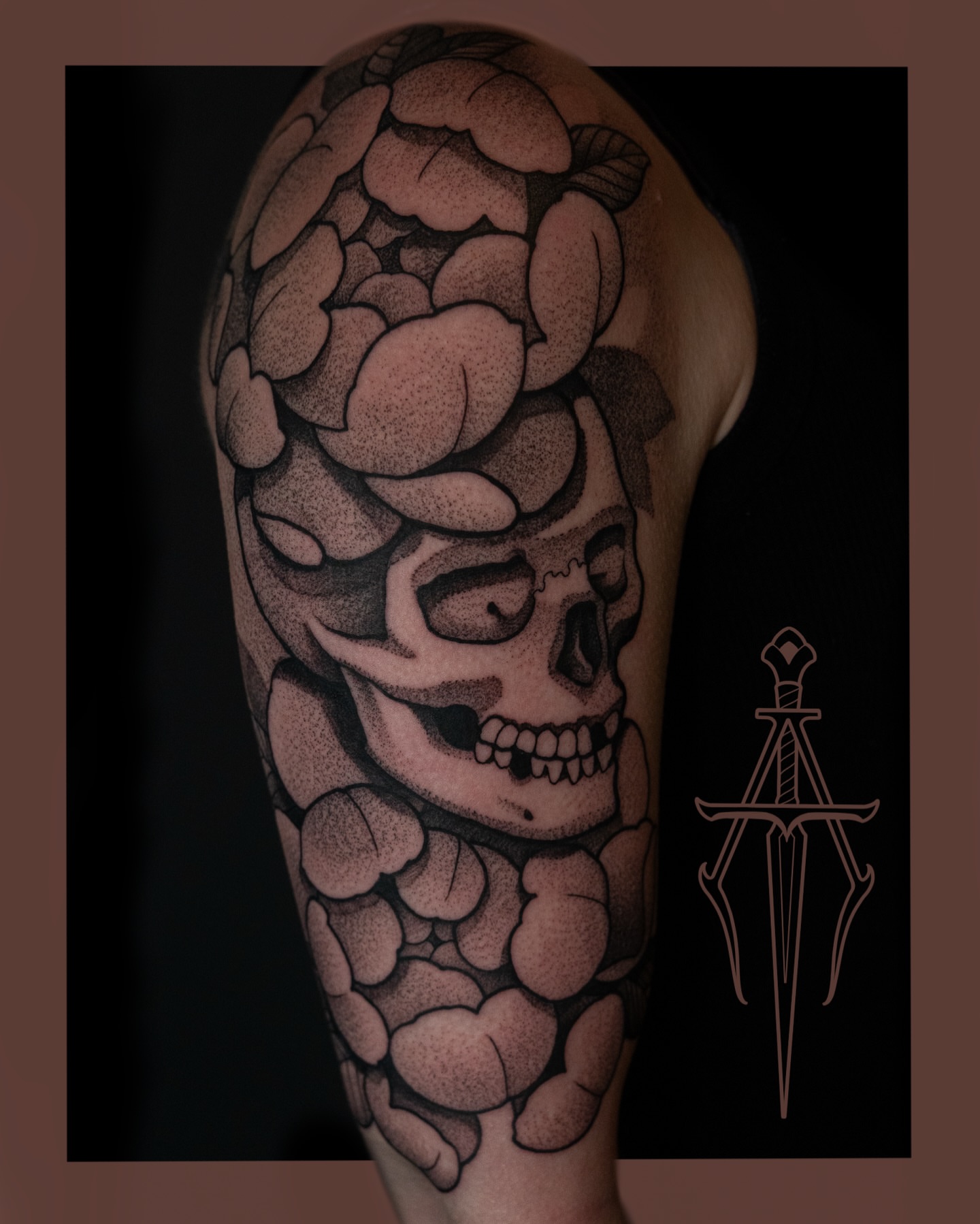 Skull and roses dotwork tattoo on the forearm by Chris Dobransky