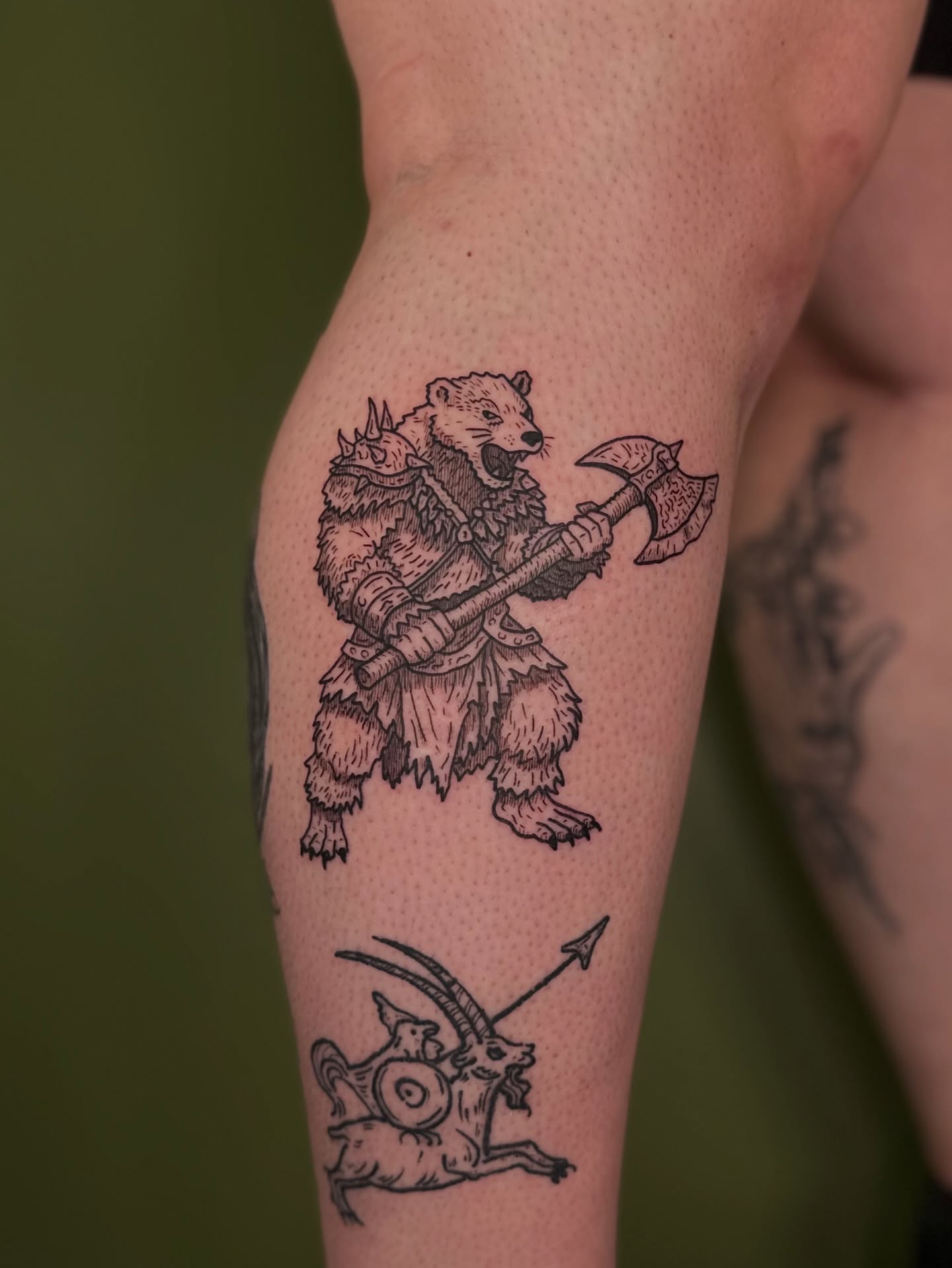 Bear warrior and goat black and grey tattoo on the thigh by Nikolas Tapio Aatos Mäkelä