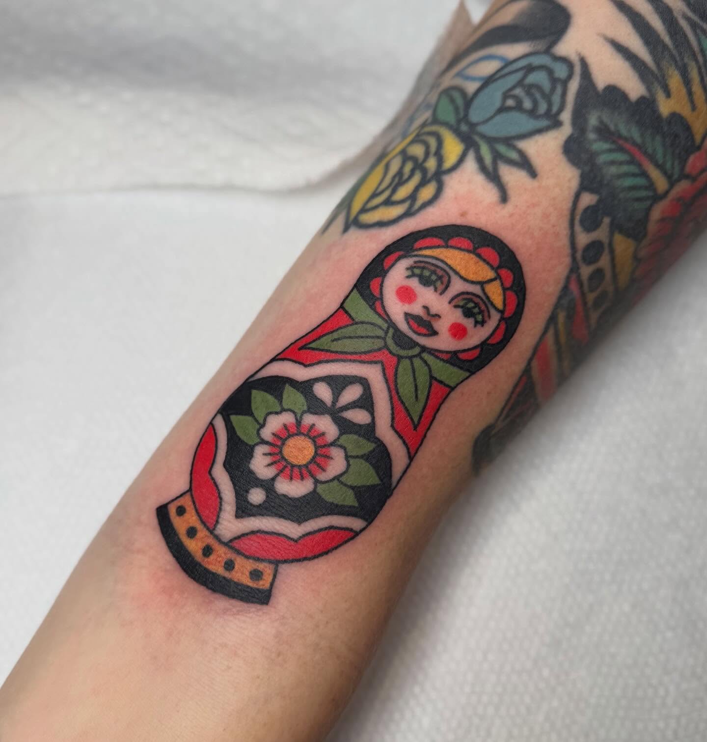 Matryoshka doll American traditional tattoo on the forearm by Elle Yax