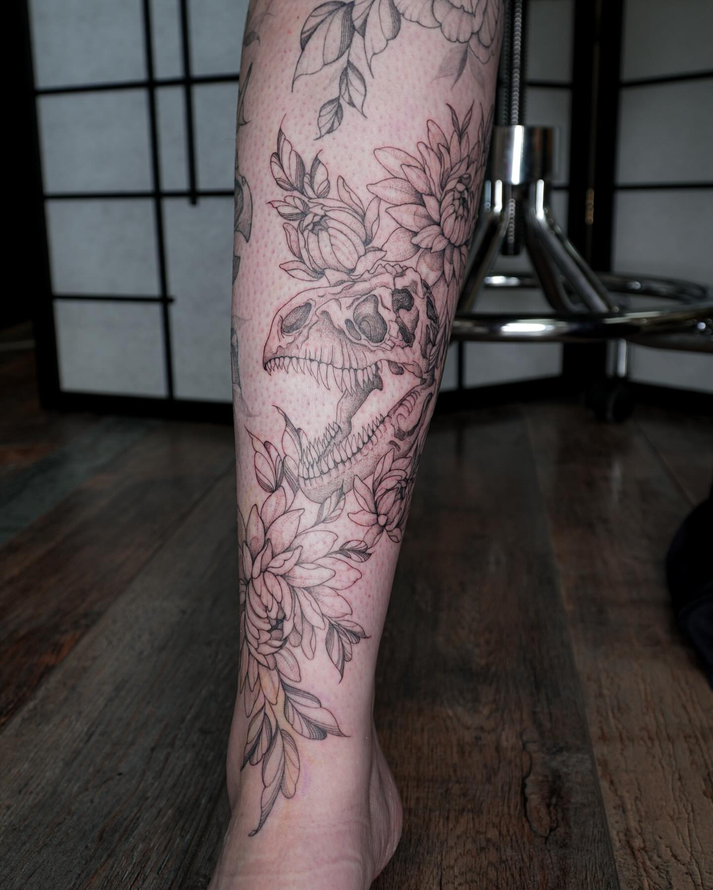 Skull and flowers black and grey tattoo on the calf by Pandora ✨ Floral, Los Angeles, California
