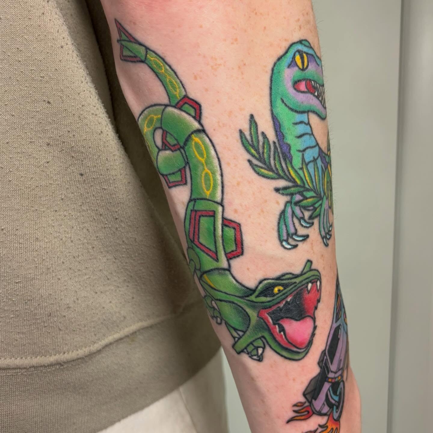 Snake and peony American traditional tattoo on the forearm by Juliet Miller