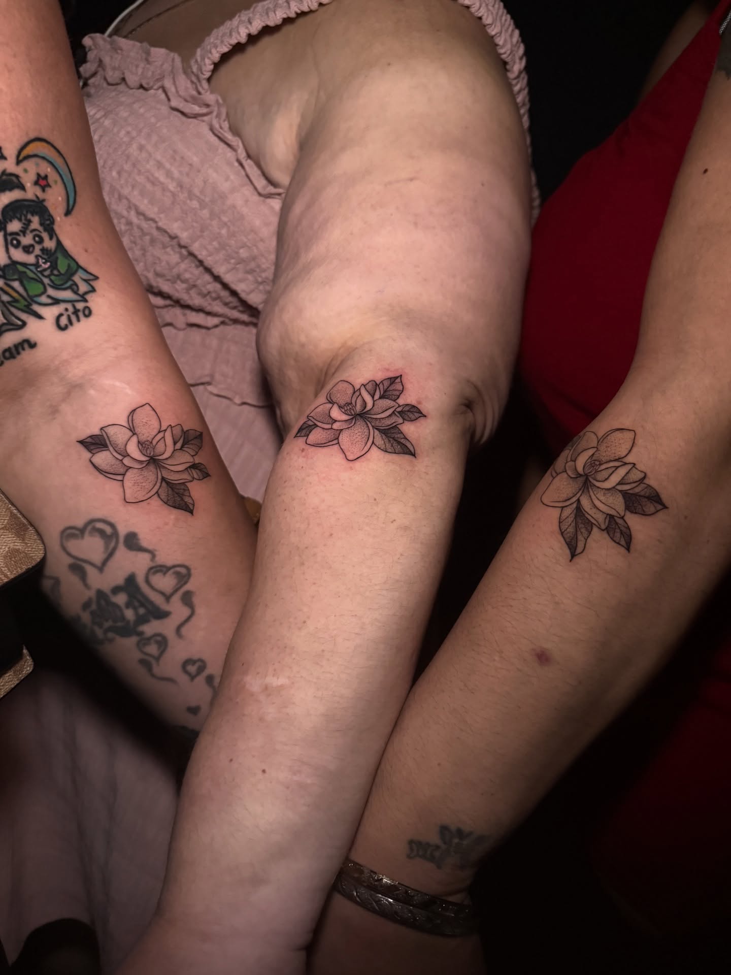 Lotus flower black and grey tattoo on the forearm by Lauren B