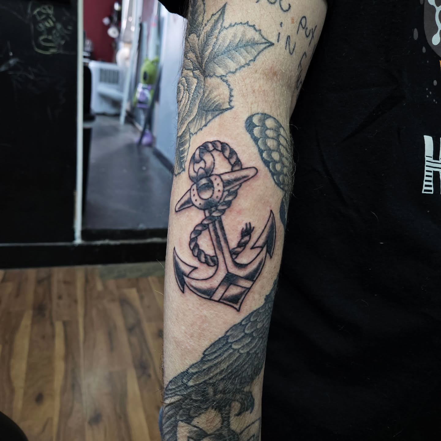 Anchor black and grey tattoo on the forearm by Danny