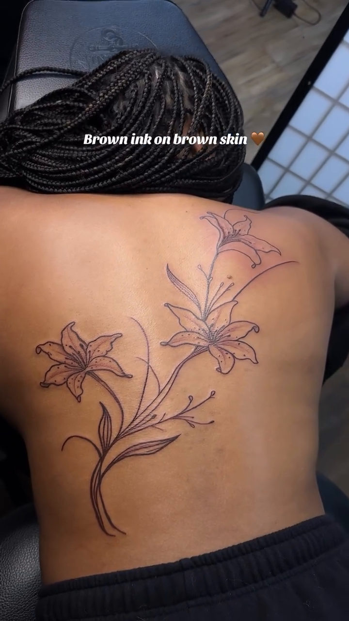 Lily flowers on back fine line tattoo on the back by TC 🧚🏽, Columbus, OH