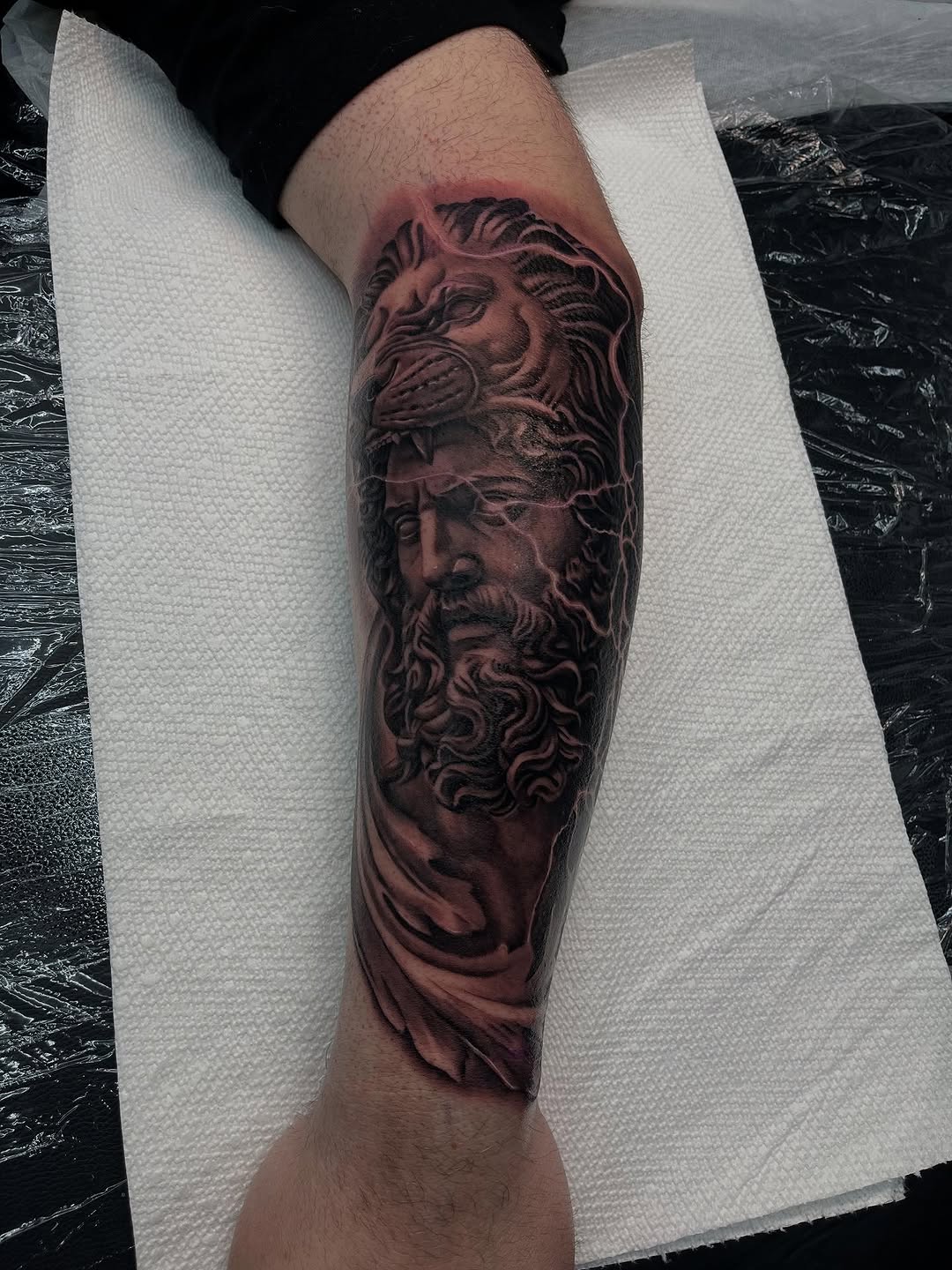 Hercules wearing the Nemean lion skin realism tattoo on the forearm by Denver Tattoo Artist