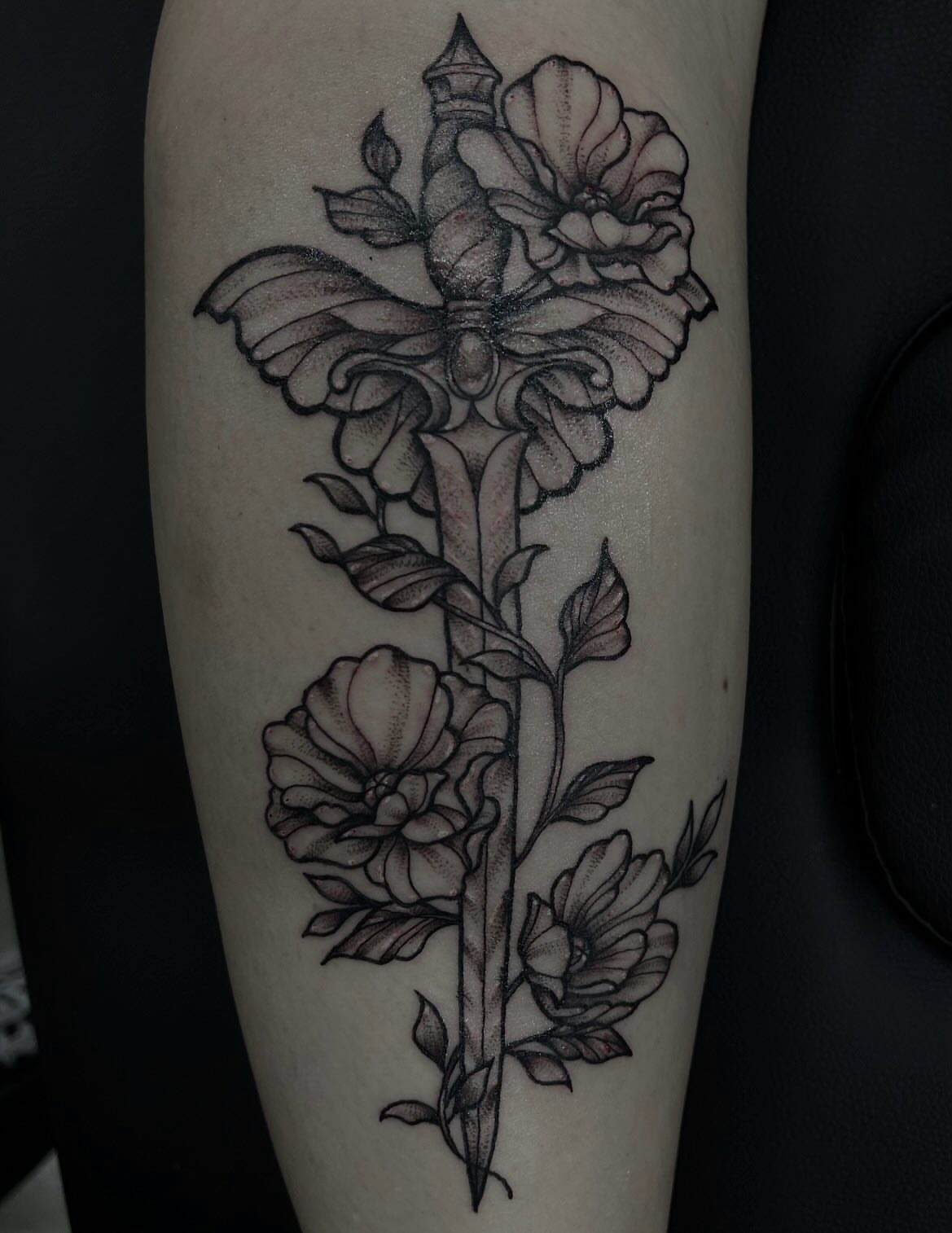 Flower and sword dotwork tattoo on the forearm by abby ☽ marie