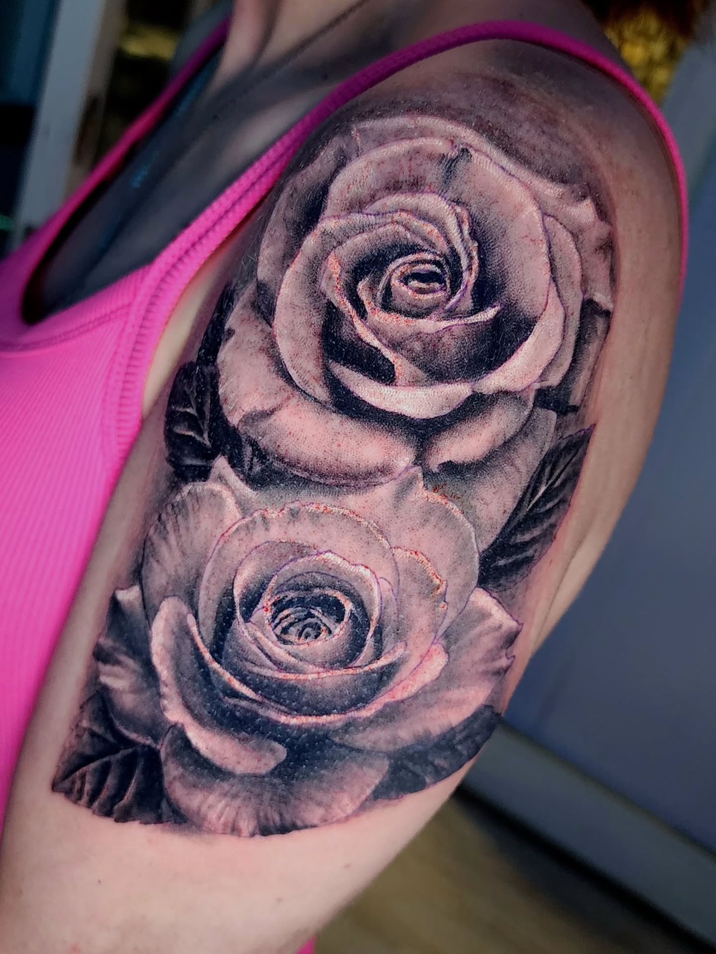 Roses realism tattoo on the shoulder by Zach Mullins