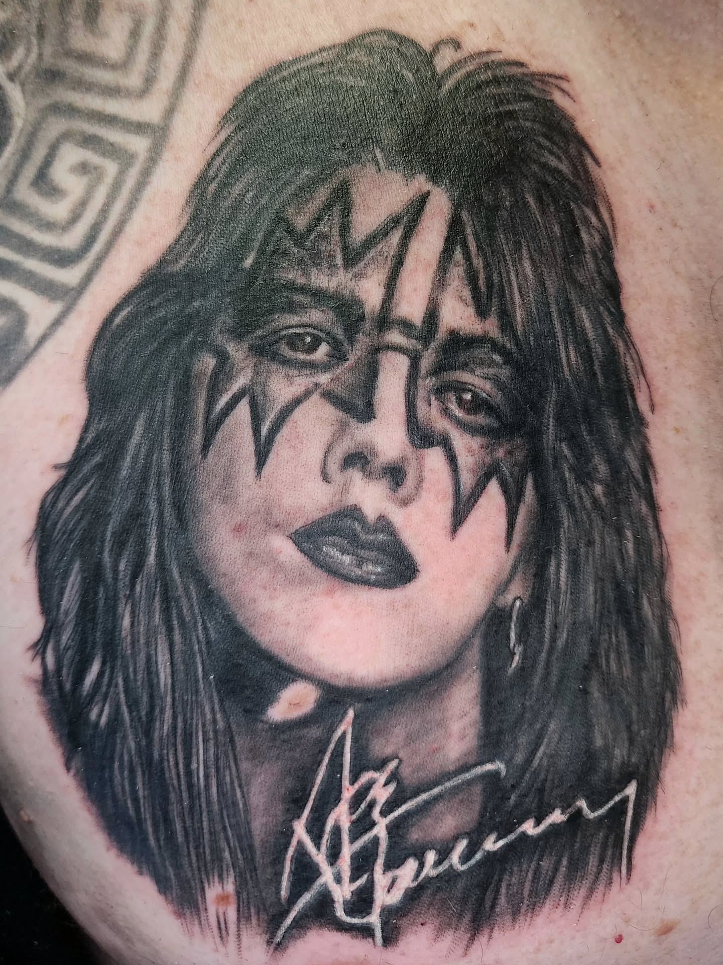 Face with makeup black and grey tattoo on the chest by Zach Mullins