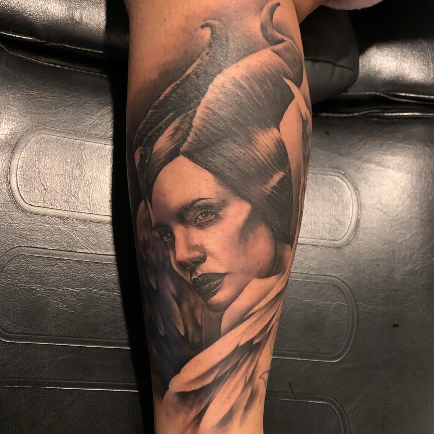Woman with horns realism tattoo on the forearm by Keith (KAM) Miller