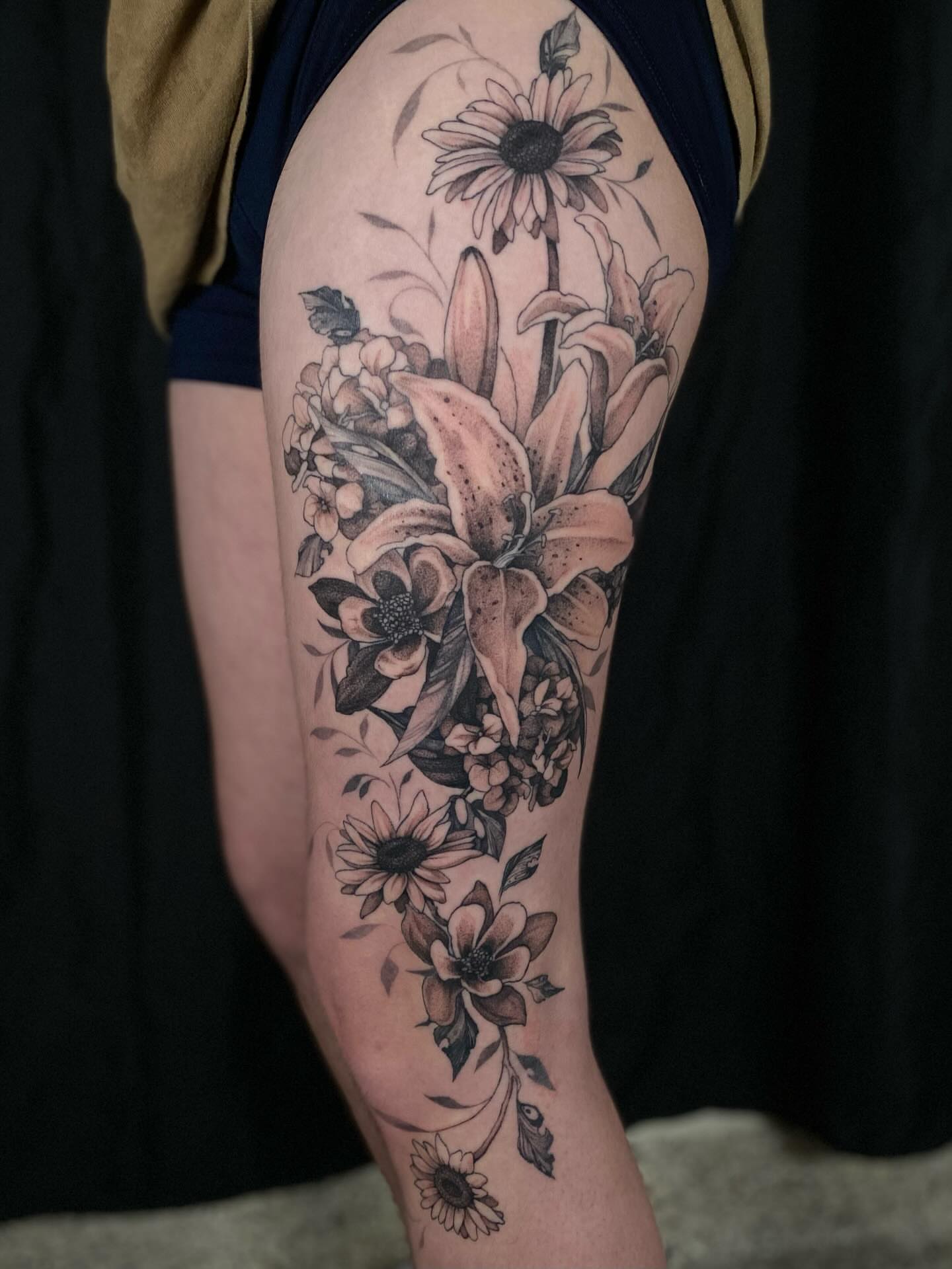 Floral bouquet realism tattoo on the forearm by Olivia Scott - Kansas Tattoo Artist