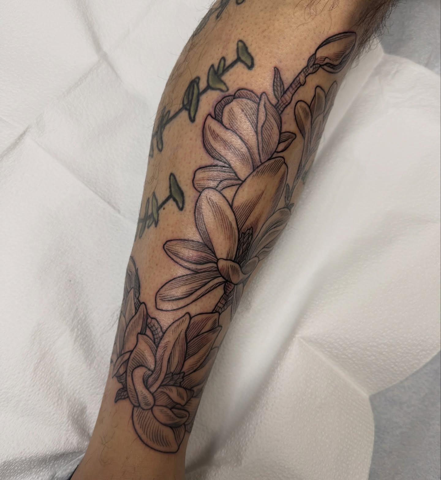 Magnolia flowers black and grey tattoo on the forearm by Taylor 🍂☕️
