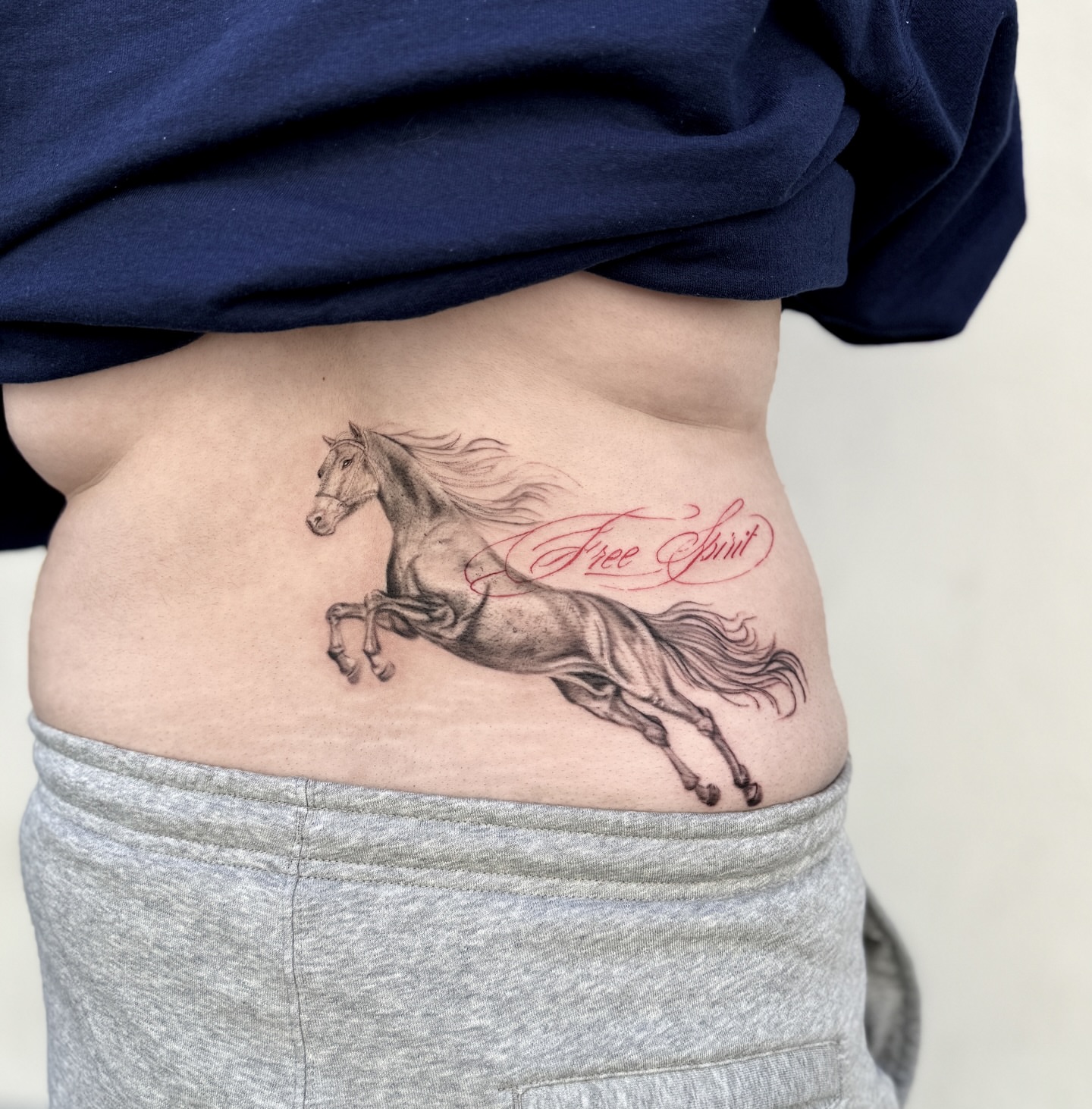 Galloping horse realism tattoo on the ribs by Raleigh tattoo artist, Raleigh, North Carolina