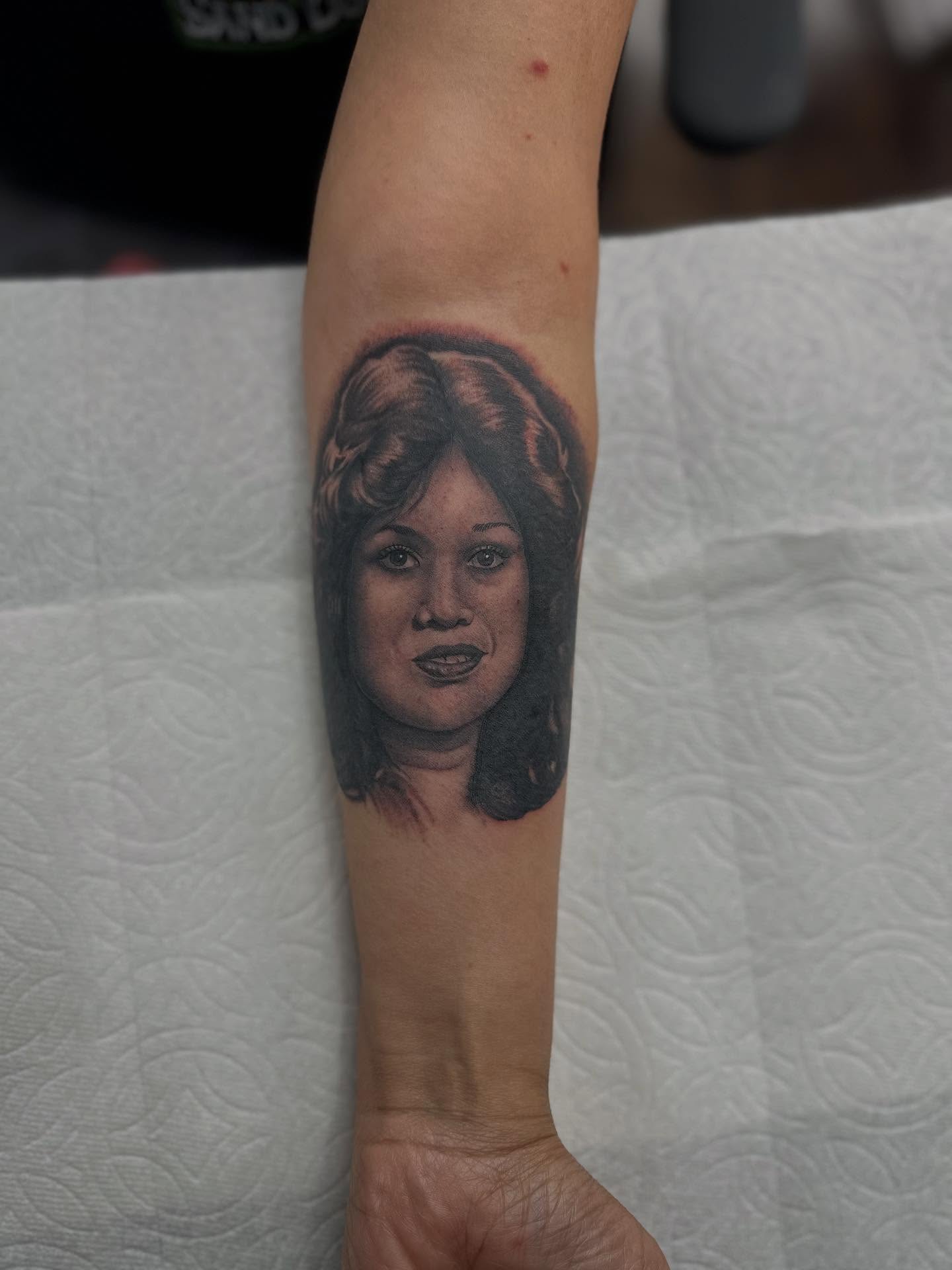 Portrait realism tattoo on the forearm by Ruben