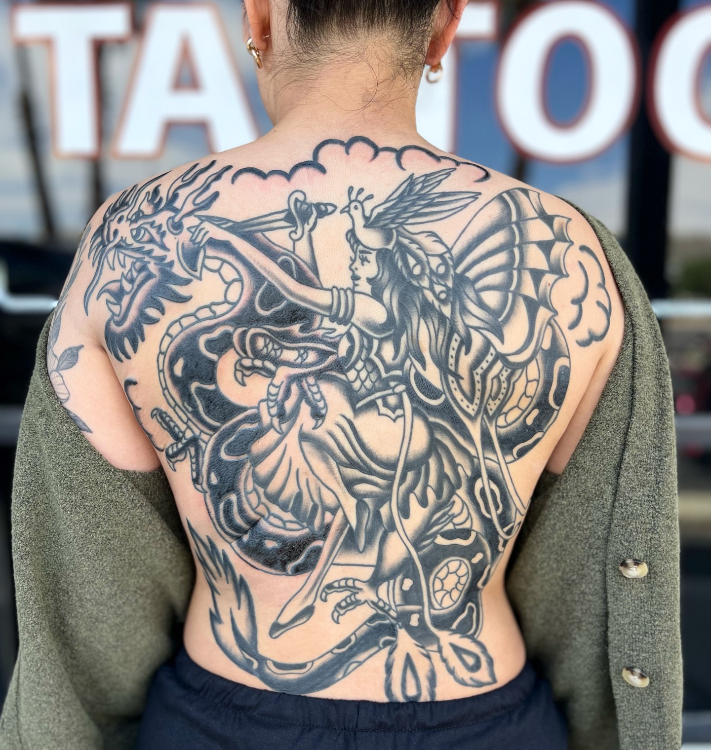 Mythical warrior American traditional tattoo on the back by Vivian Nguyen