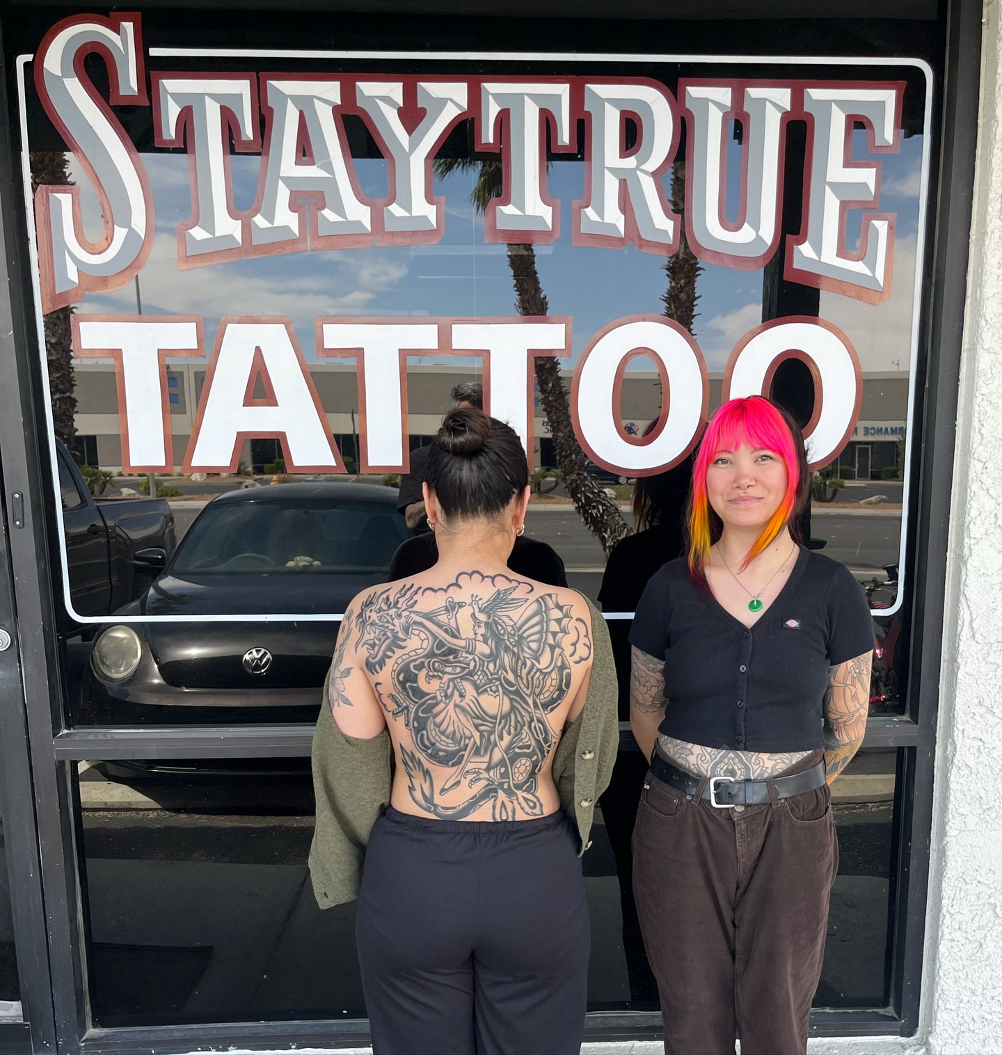 Woman with back tattoo American traditional tattoo on the back by Vivian Nguyen