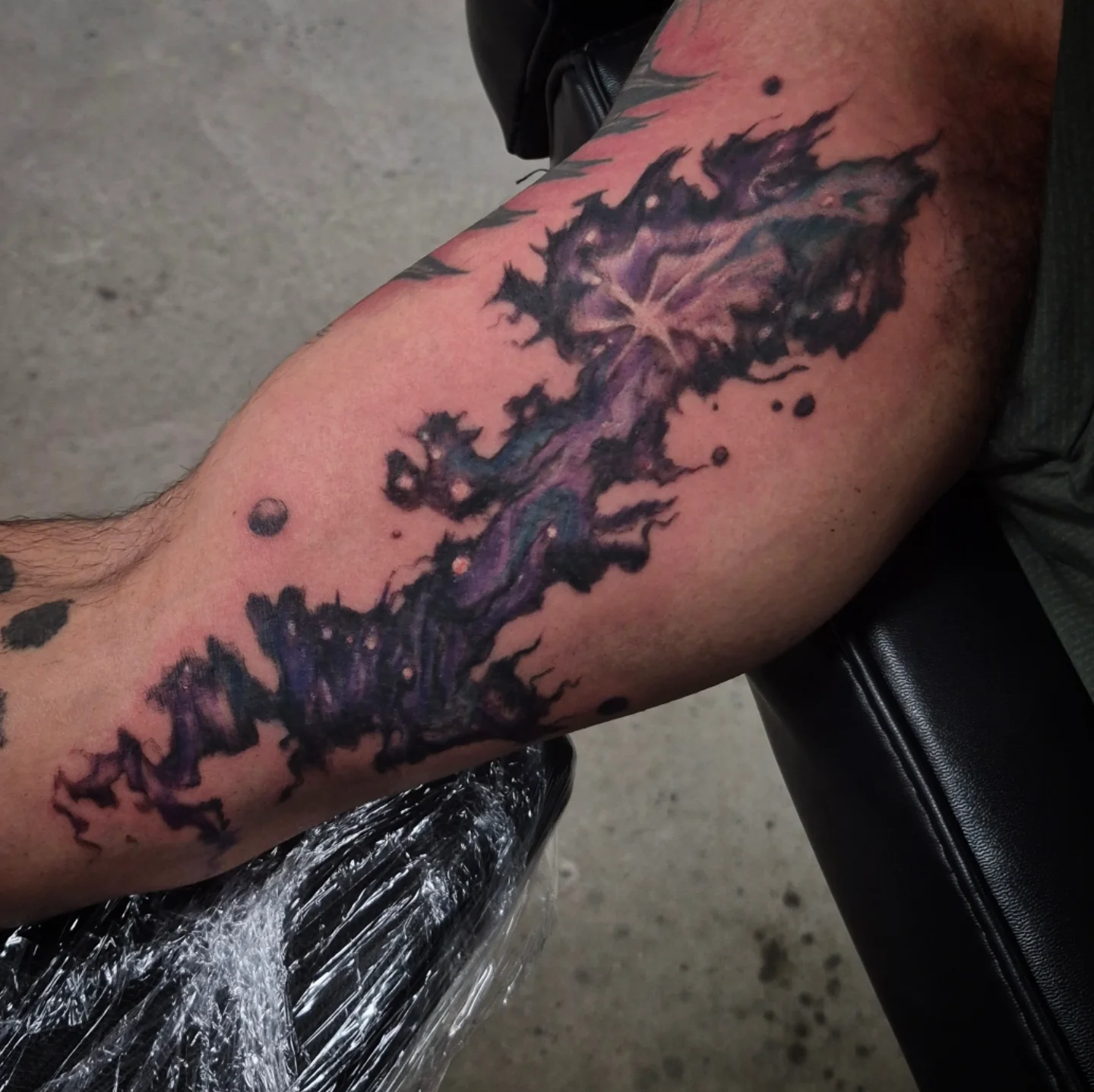 Abstract galaxy dotwork tattoo on the forearm by Lydia Kiley