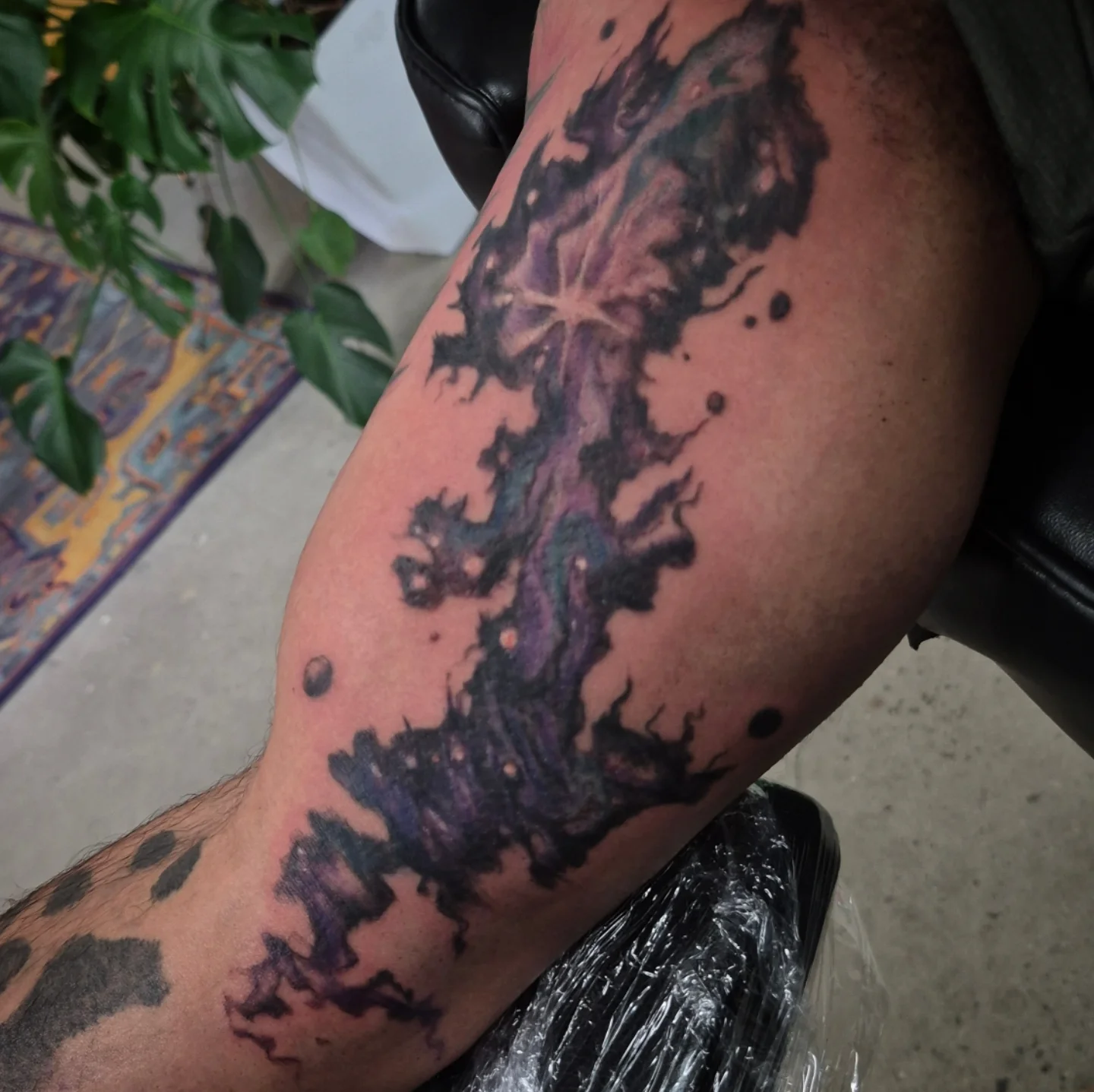 Abstract flame dotwork tattoo on the forearm by Lydia Kiley