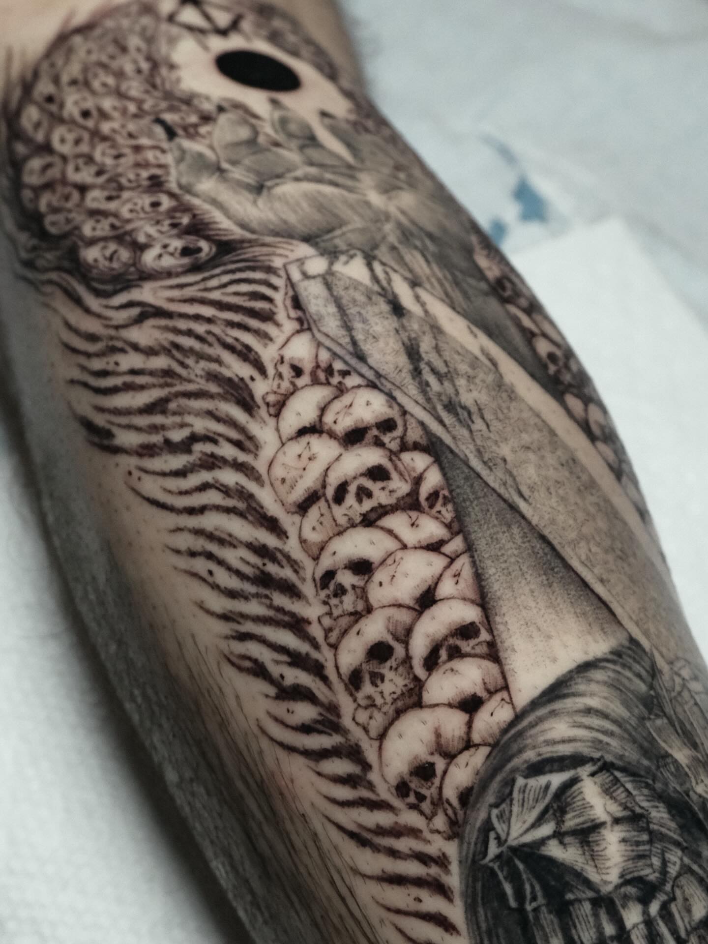 Skulls and feathers realism tattoo on the forearm by HanaKaki