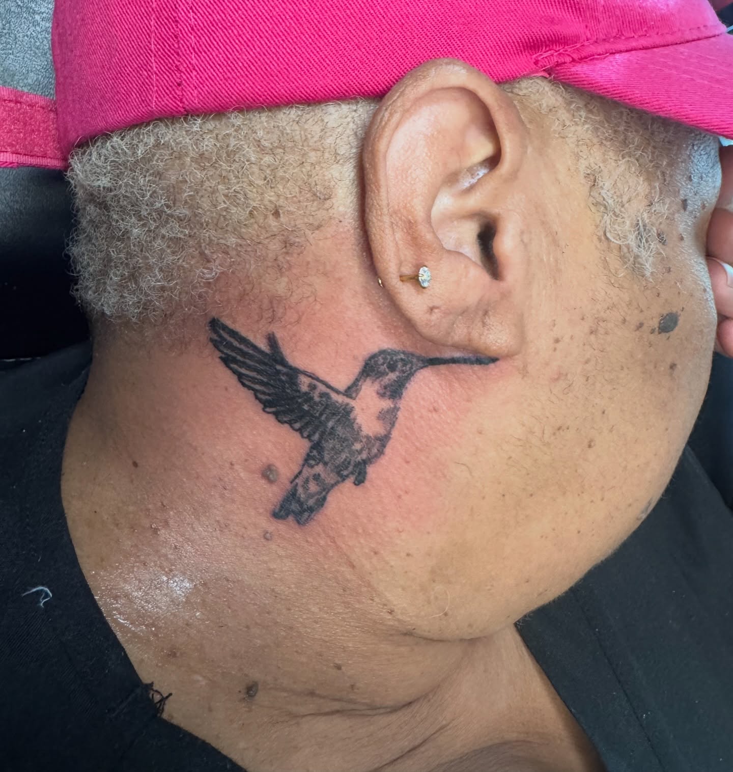Hummingbird black and grey tattoo on the neck by Tyler Cooper, Las Vegas, Nevada
