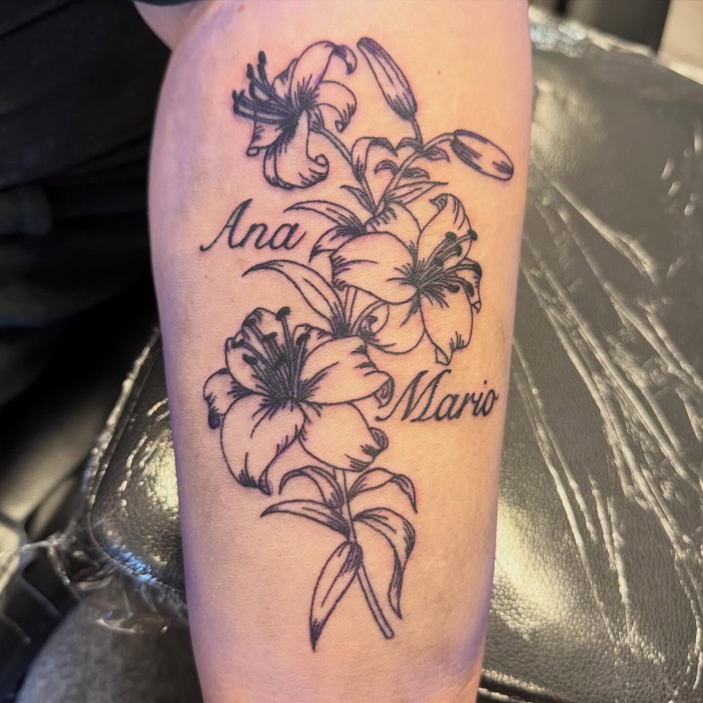 Lilies black and grey tattoo on the forearm by Shan 🤘 Tattoo Artist ⚡️ MN 🌲