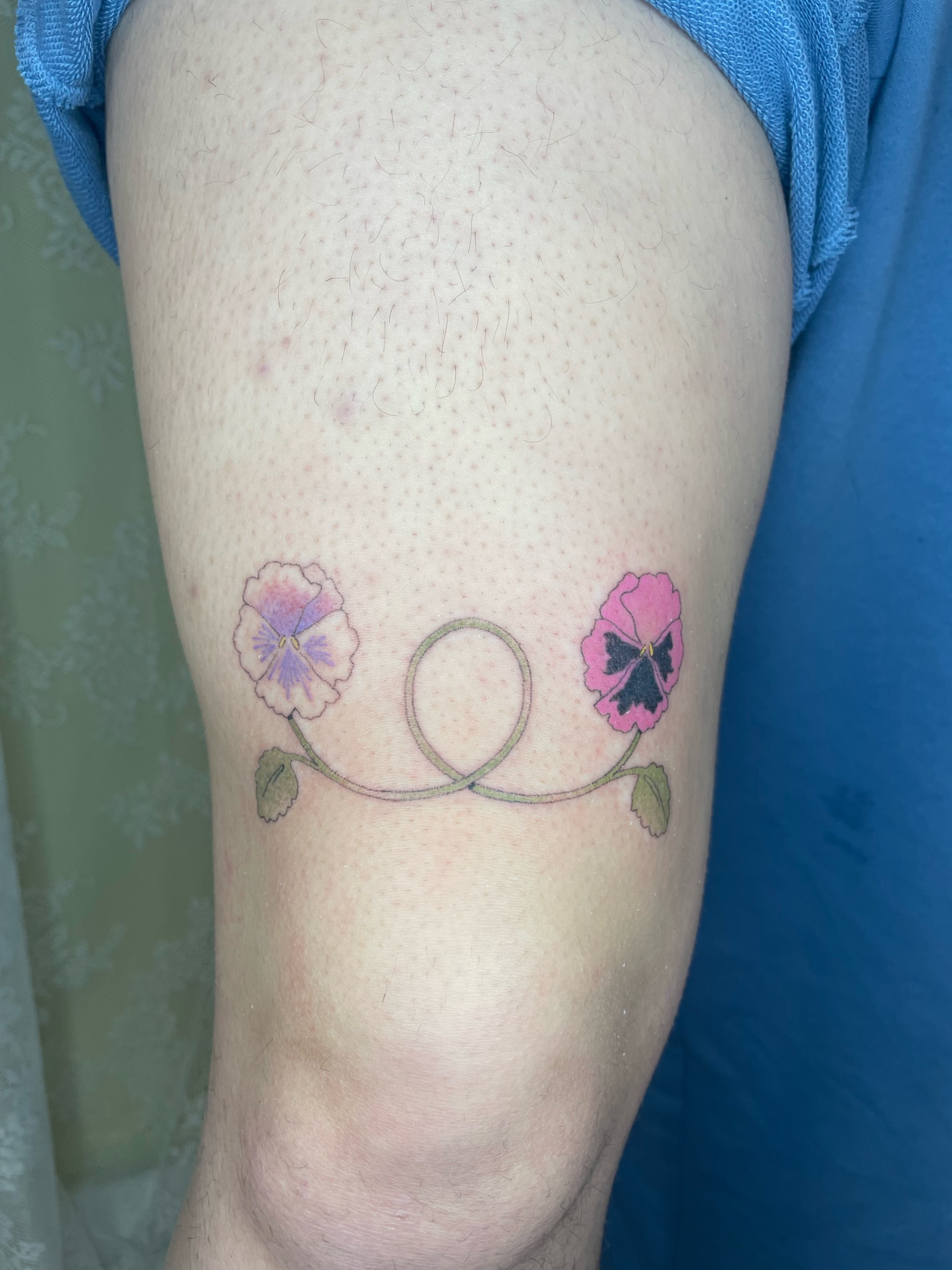 Pansies dotwork tattoo on the thigh by cait