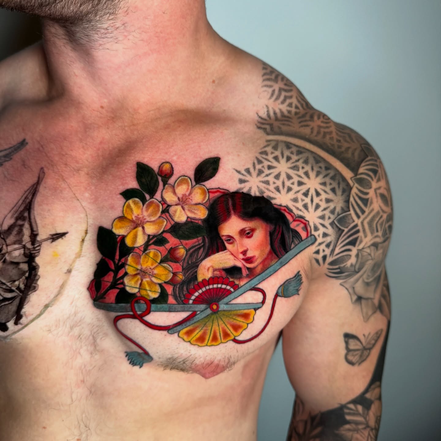 Woman with flowers japanese irezumi tattoo on the chest by Tori Bent