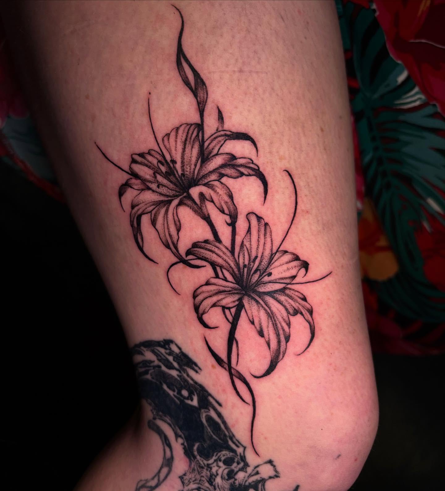 Lilies black and grey tattoo on the forearm by 𝕶𝕬𝕿