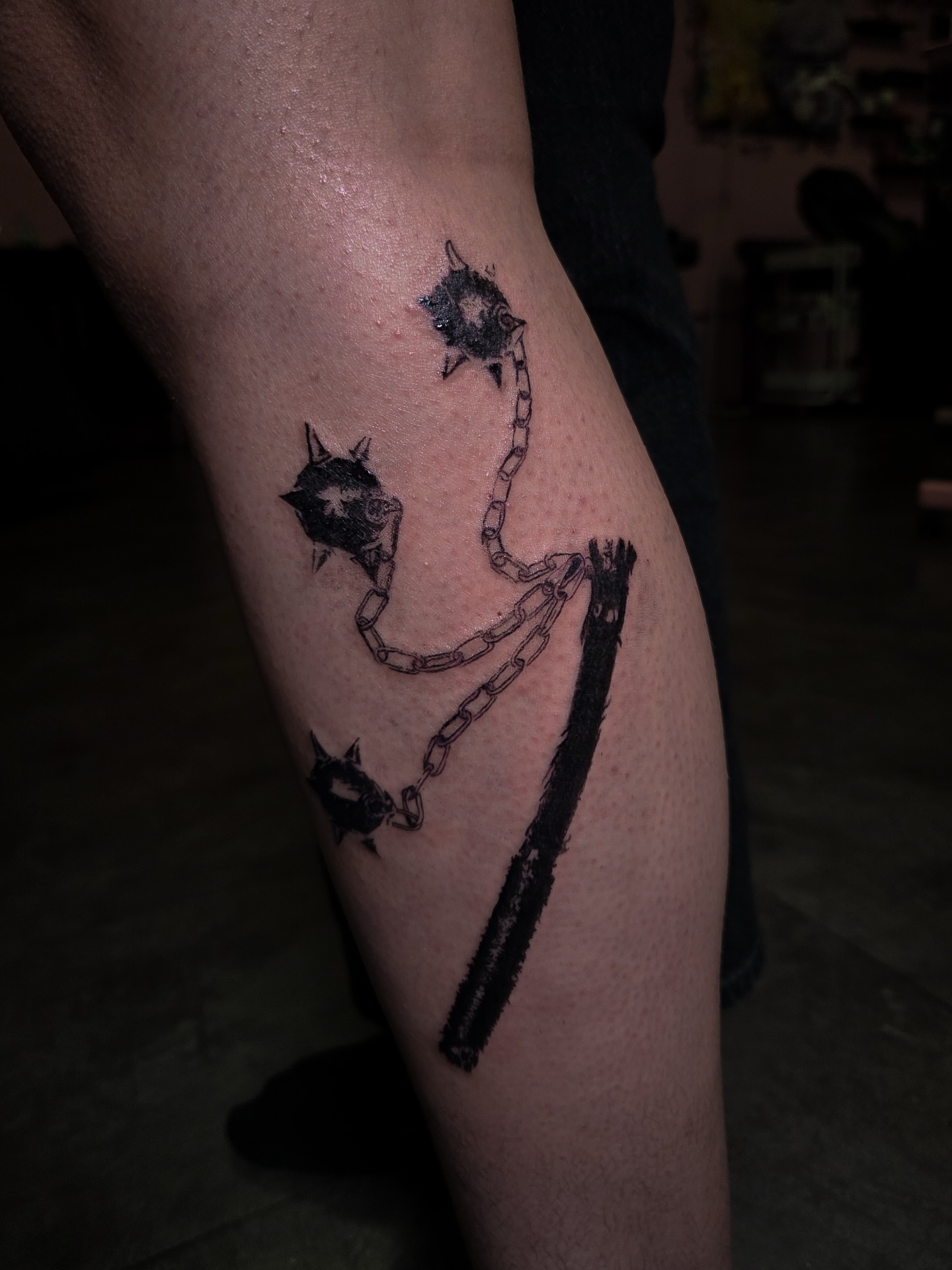 Chainsaw and chains black and grey tattoo on the leg by Tattoo Artist X Kamm, Salt Lake City, Utah