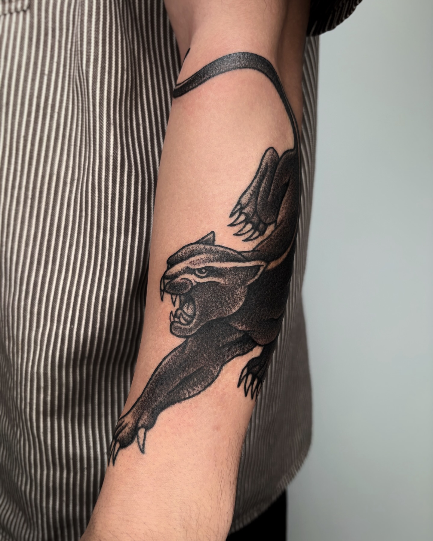Panther dotwork tattoo on the forearm by Kuya, Berkeley, California