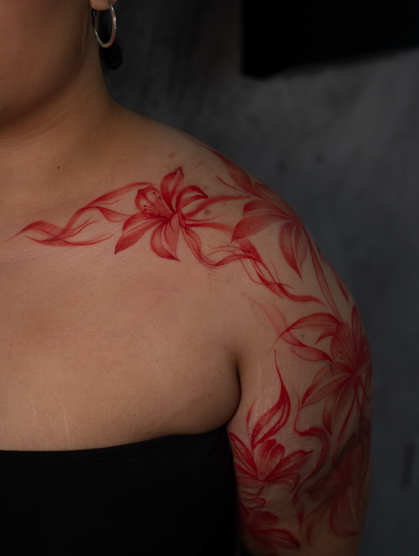 Lily realism tattoo on the shoulder by Damon Valdez