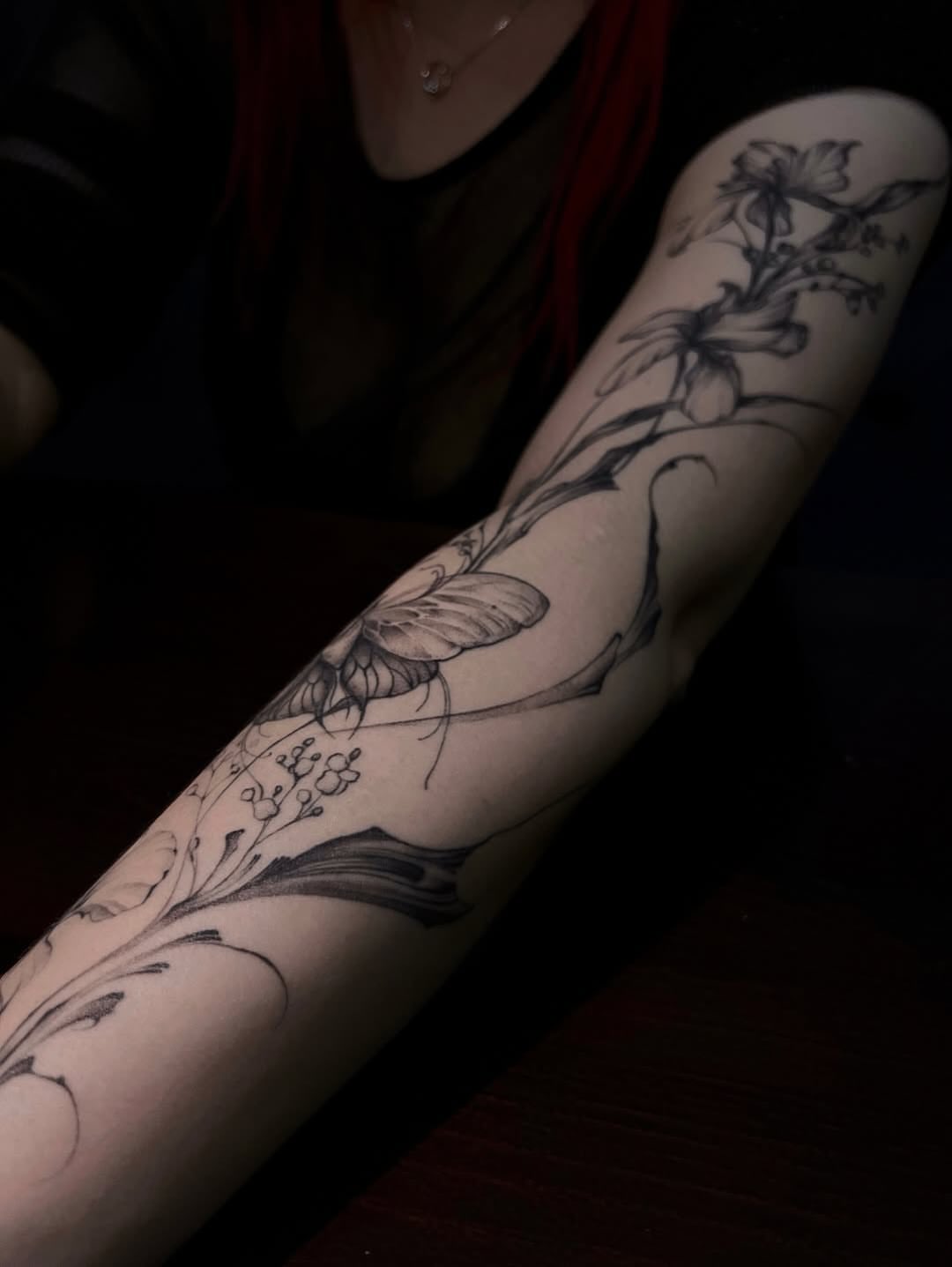 Floral design black and grey tattoo on the forearm by Nina Fedorchenko
