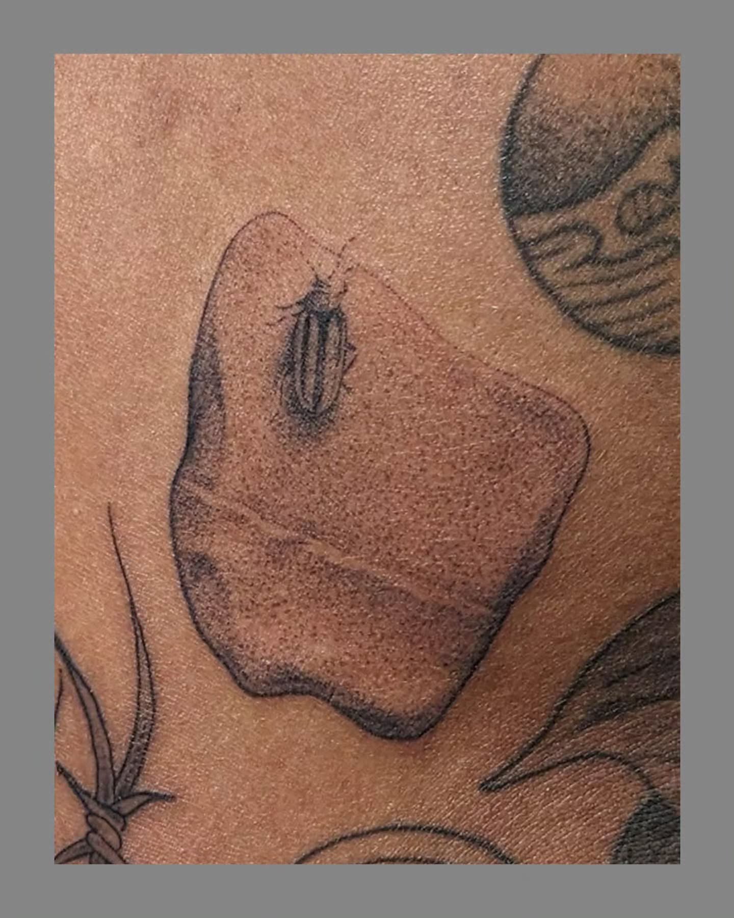 Leaf and beetle dotwork tattoo on the torso by Marria