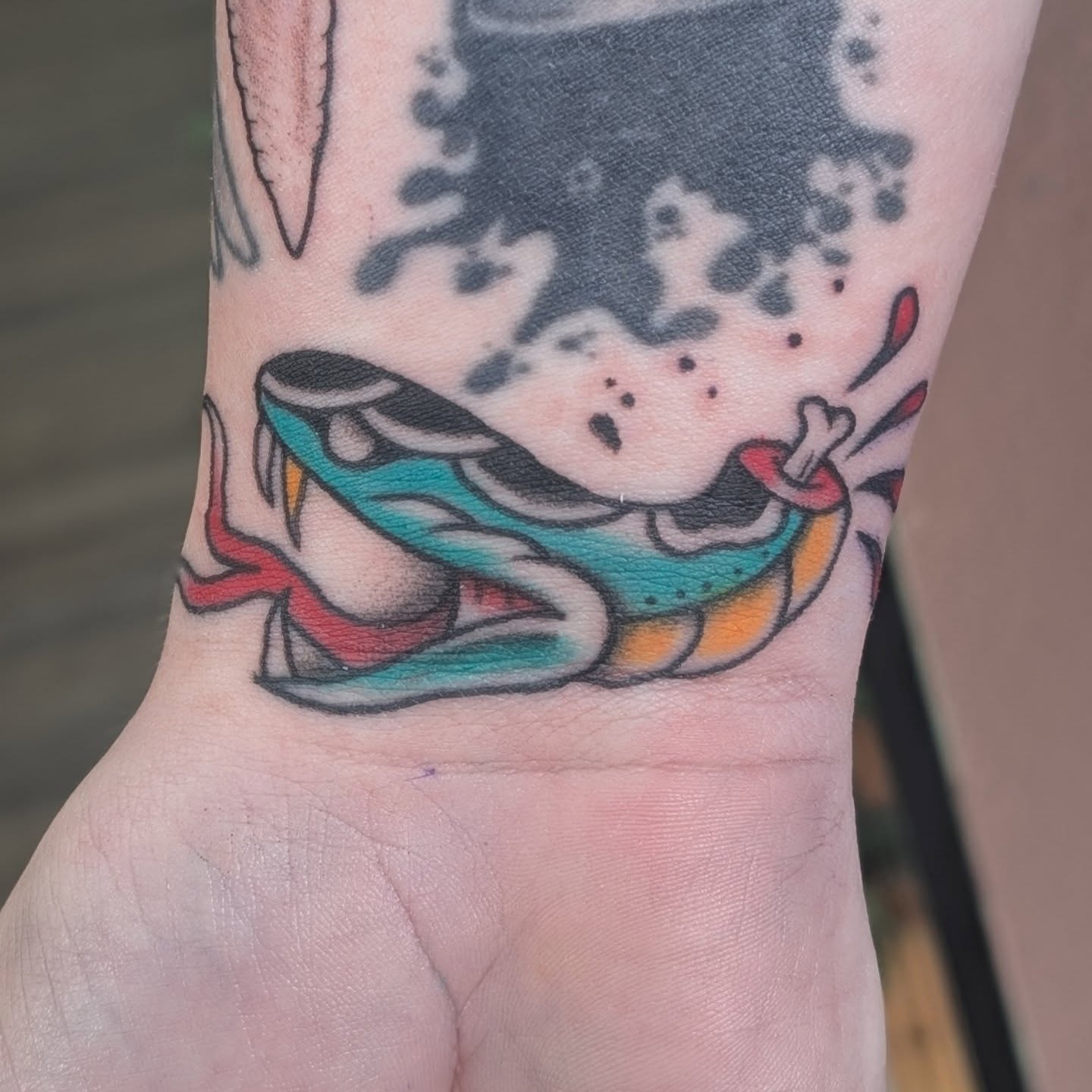 Shoe American traditional tattoo on the forearm by Alexandria Green