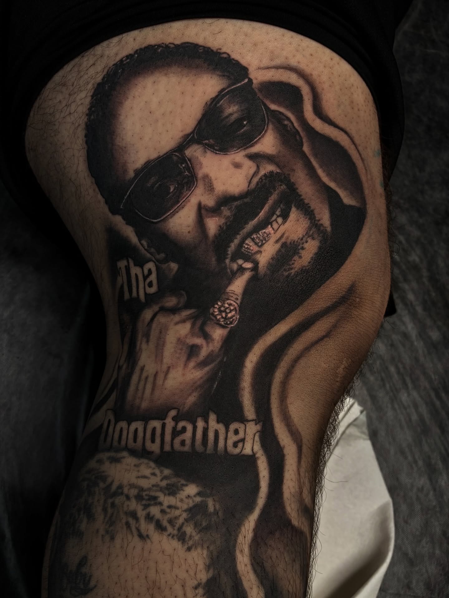 Snoop Dogg realism tattoo on the thigh by Nessa, Las Vegas, Nevada