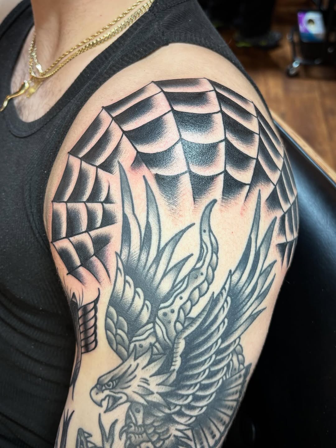 Eagle and spider web realism tattoo on the shoulder by Tom Wenzell