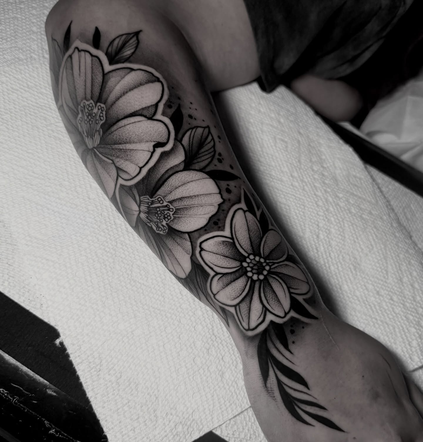 Flowers dotwork tattoo on the forearm by Clayton Smith (BEAR)