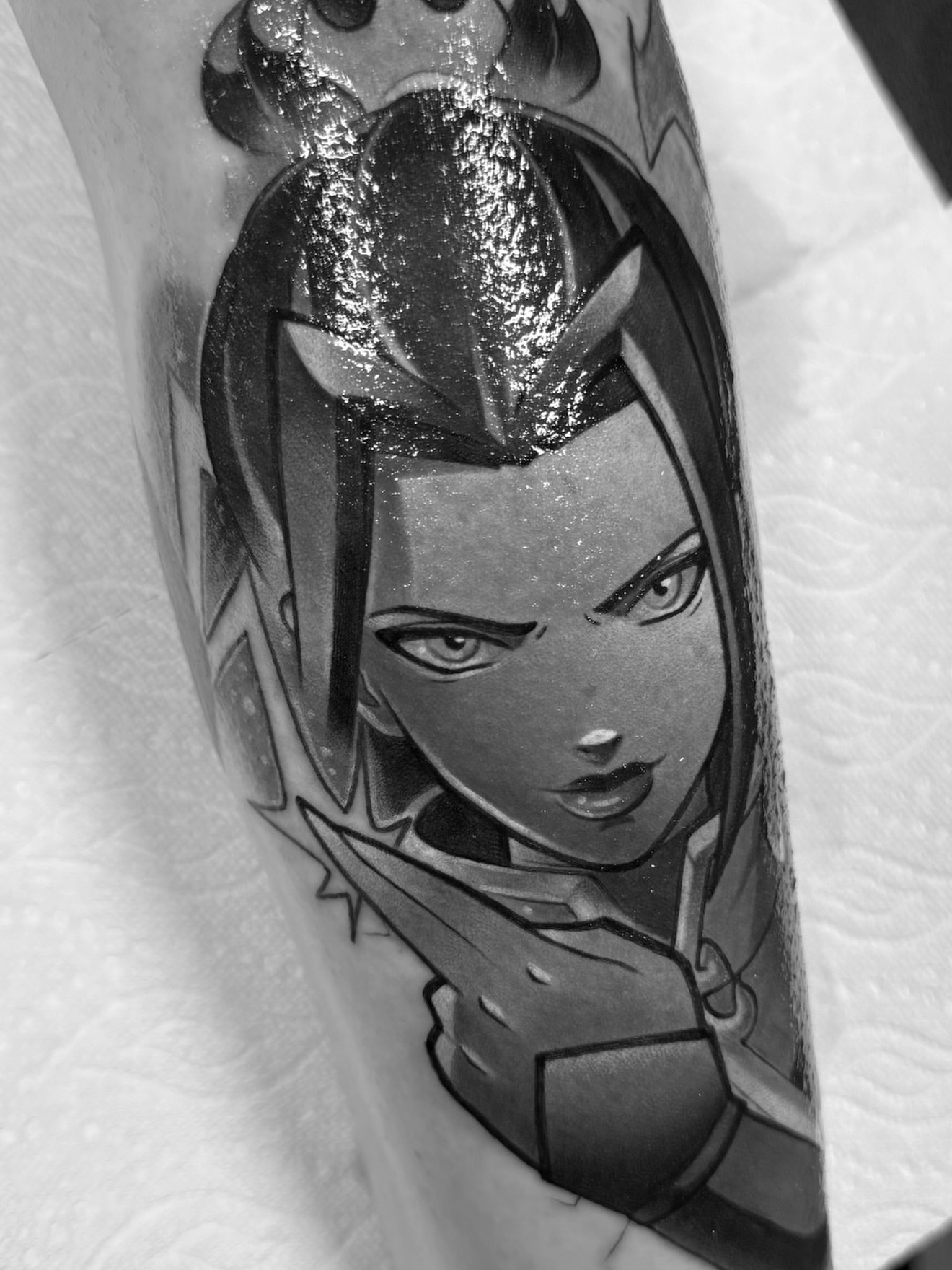 Anime character anime tattoo on the forearm by Jake lyon