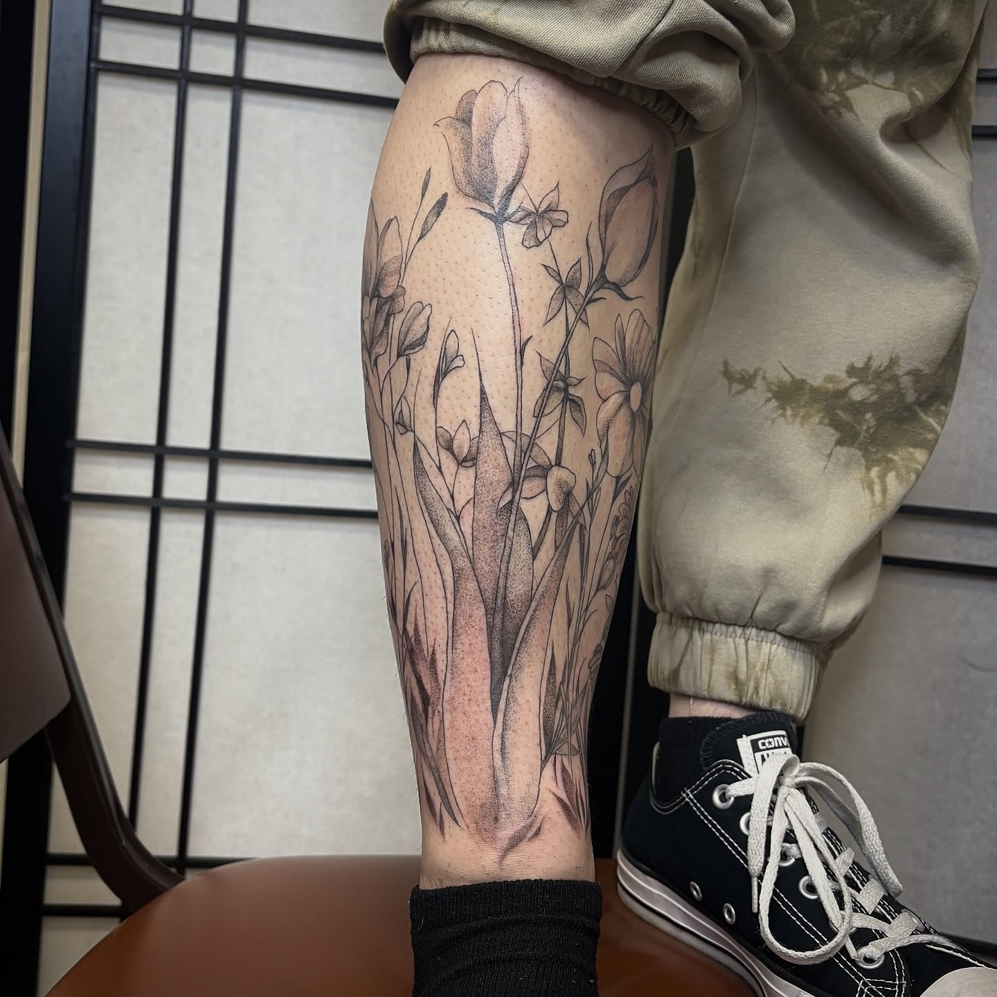 Floral arrangement black and grey tattoo on the calf by ★ Val! ★ Tattoo Artist