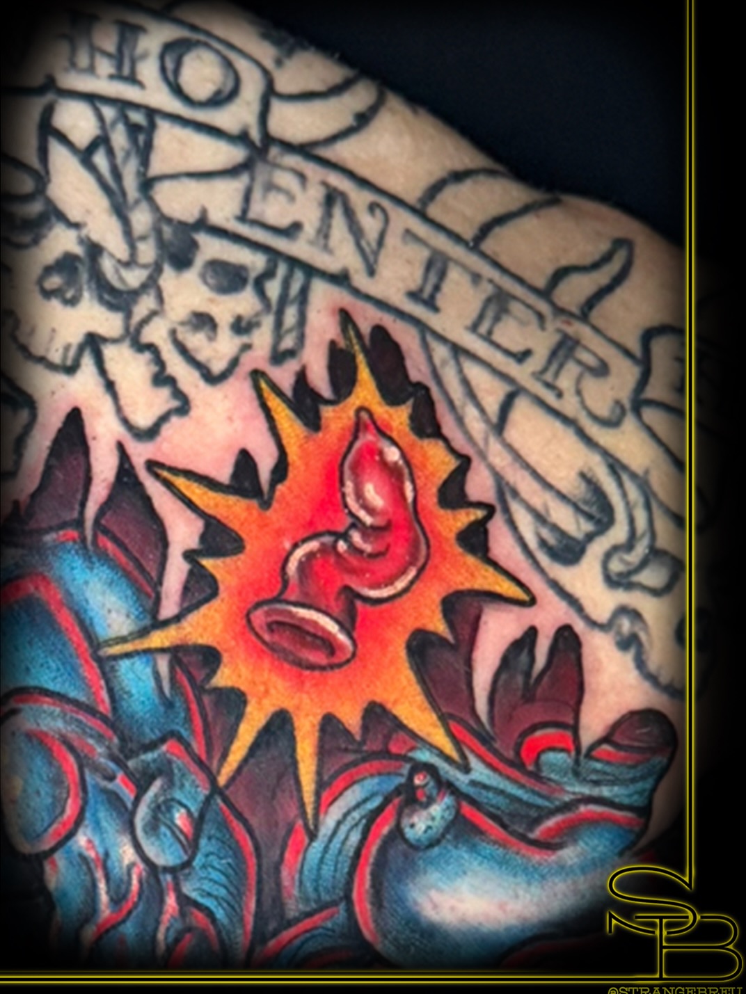 Exploding bomb American traditional tattoo on the forearm by Chris Breuer, Asbury Park, New Jersey