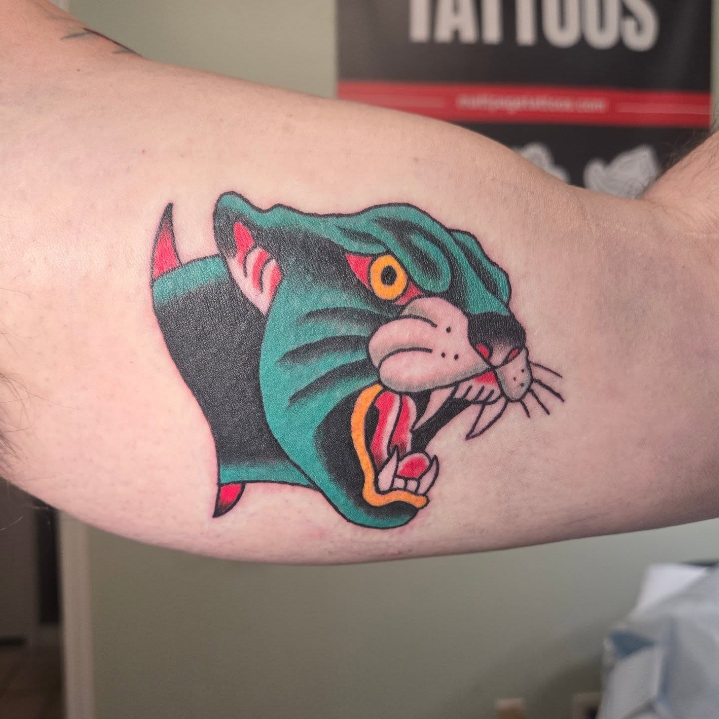 Angry cat American traditional tattoo on the forearm by Matt Page